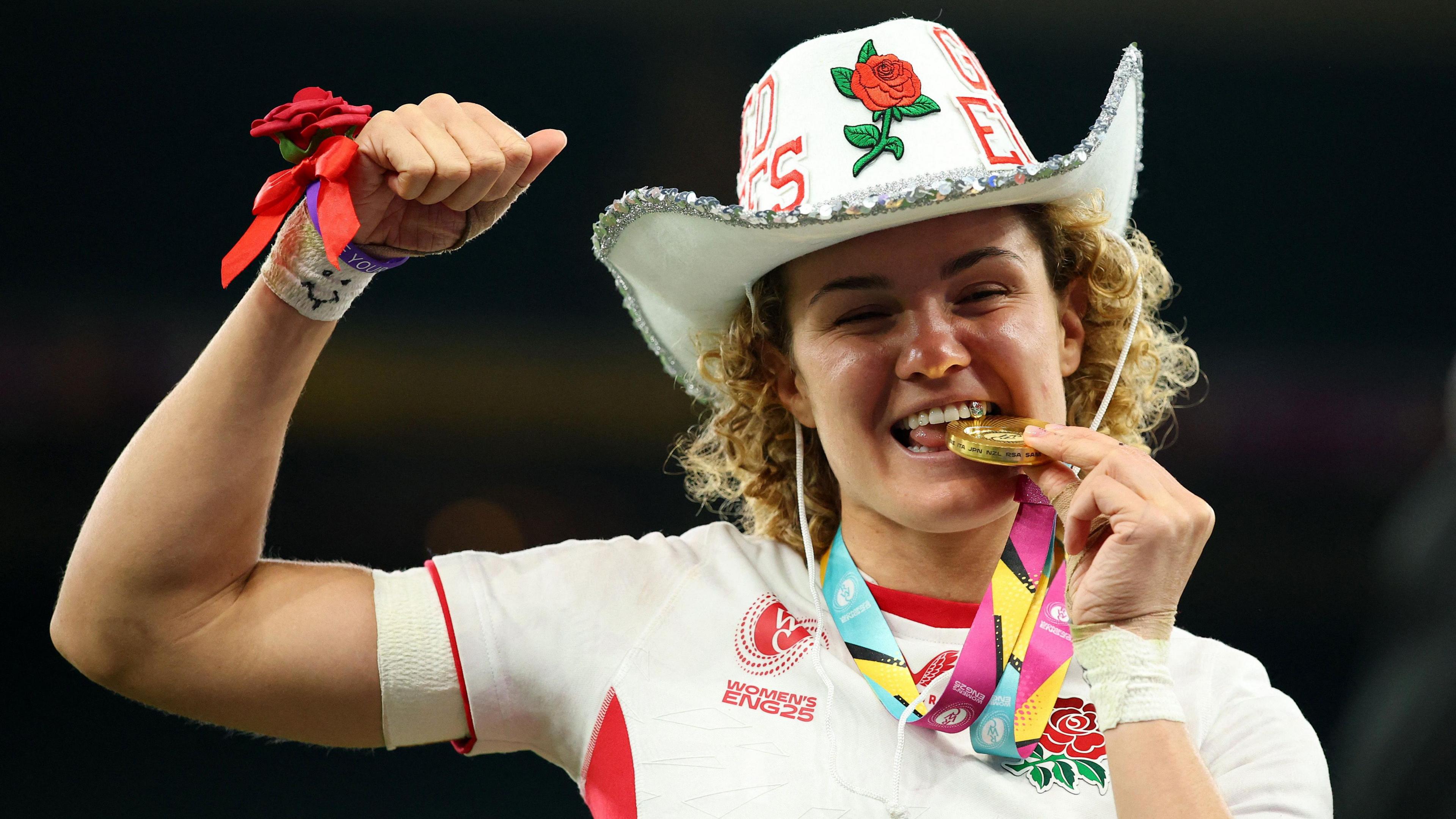 Rugby Union - Women's World Cup 2025 - Final - Canada v England - Allianz Stadium, Twickenham, London, Britain - September 27, 2025
England's Ellie Kildunne celebrates with her medal and a hat after winning the final Action Images via Reuters/Andrew Boyers