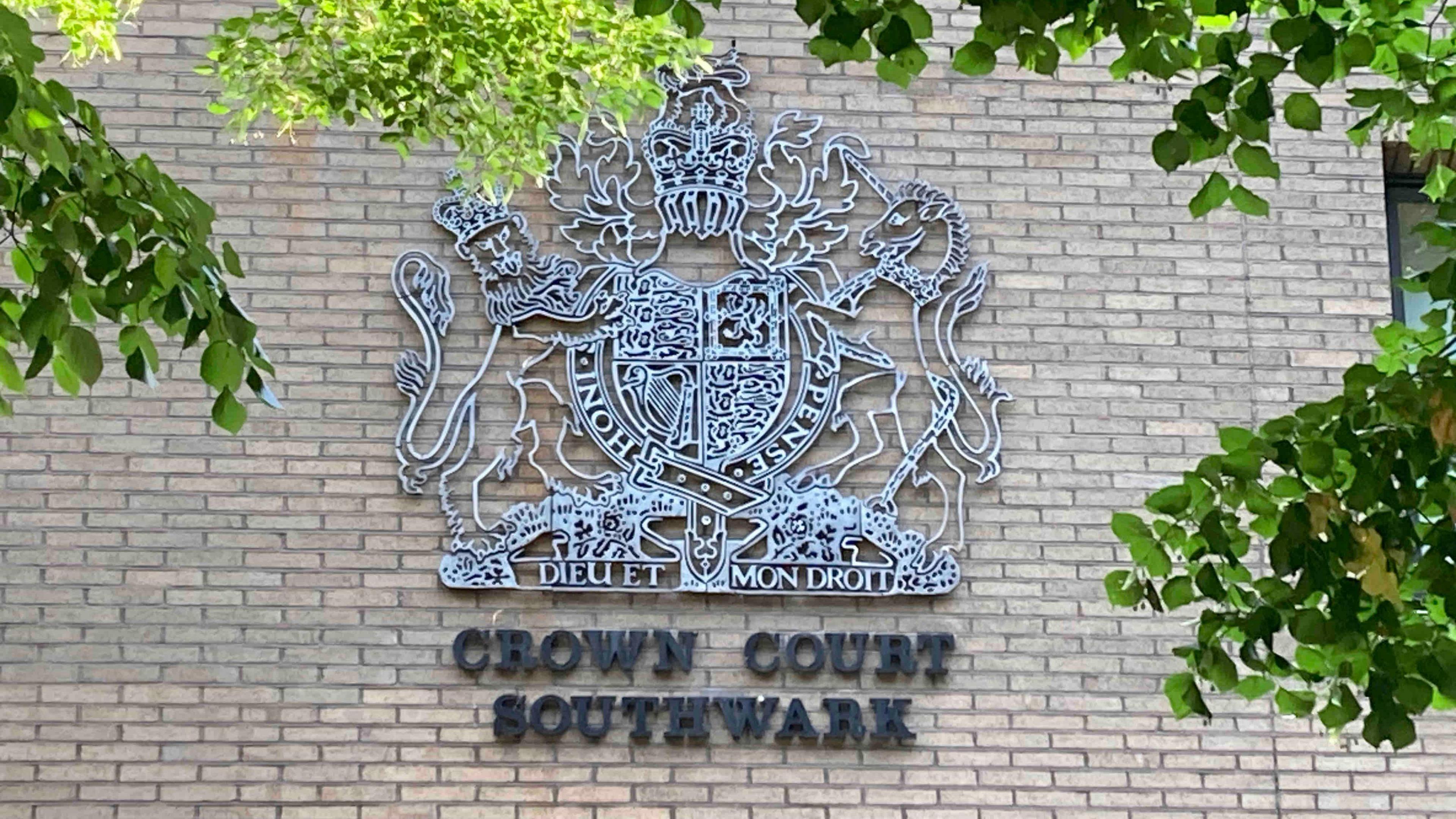 A general view of a crown court sign on the side of a building. It reads Crown Court Southwark.