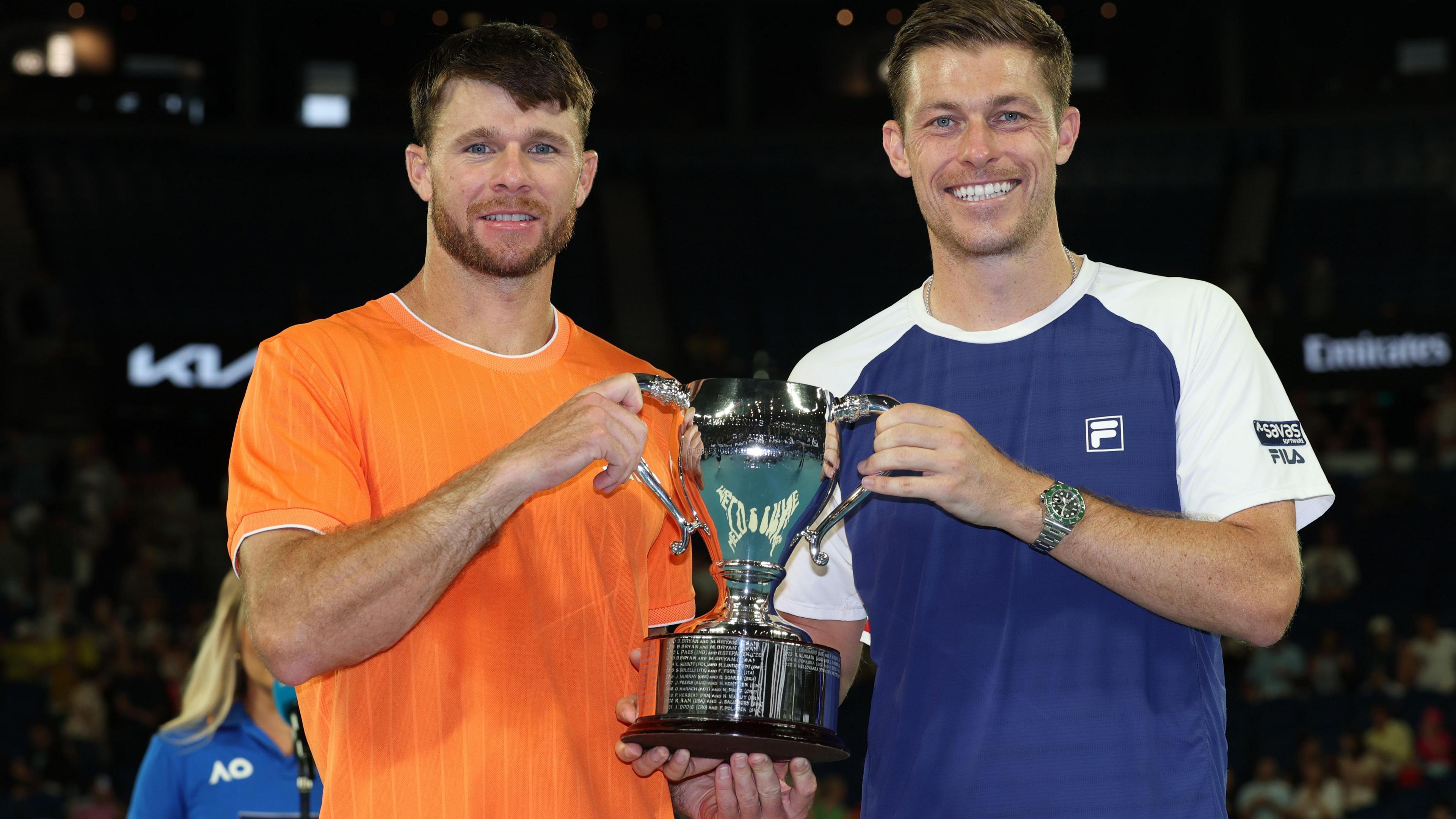 Christian Harrison and Neal Skupski hold the Australian Open men's doubles trophy