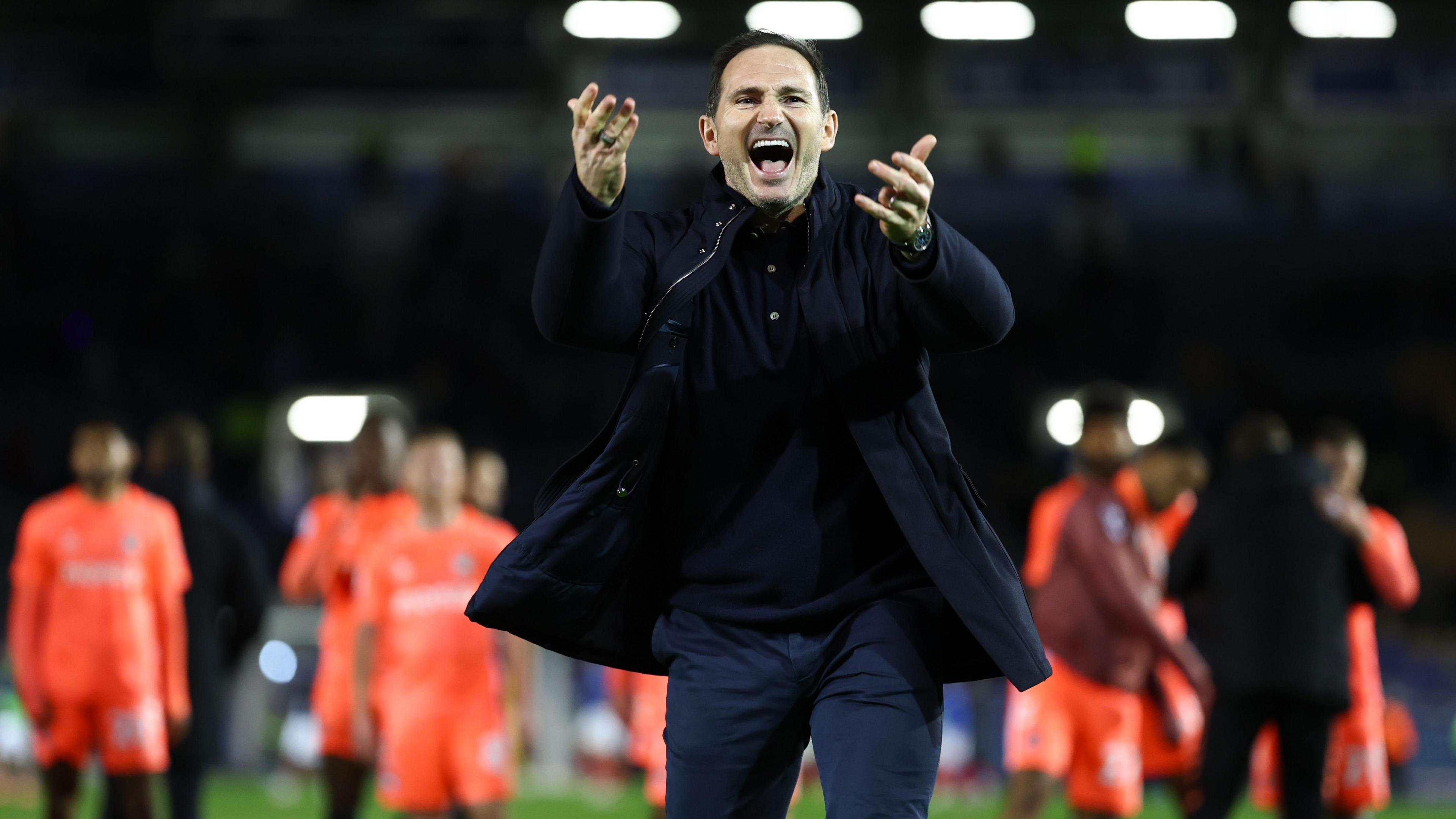 Frank Lampard grins and claps his hands in celebration with the Coventry fans after beating Portsmouth