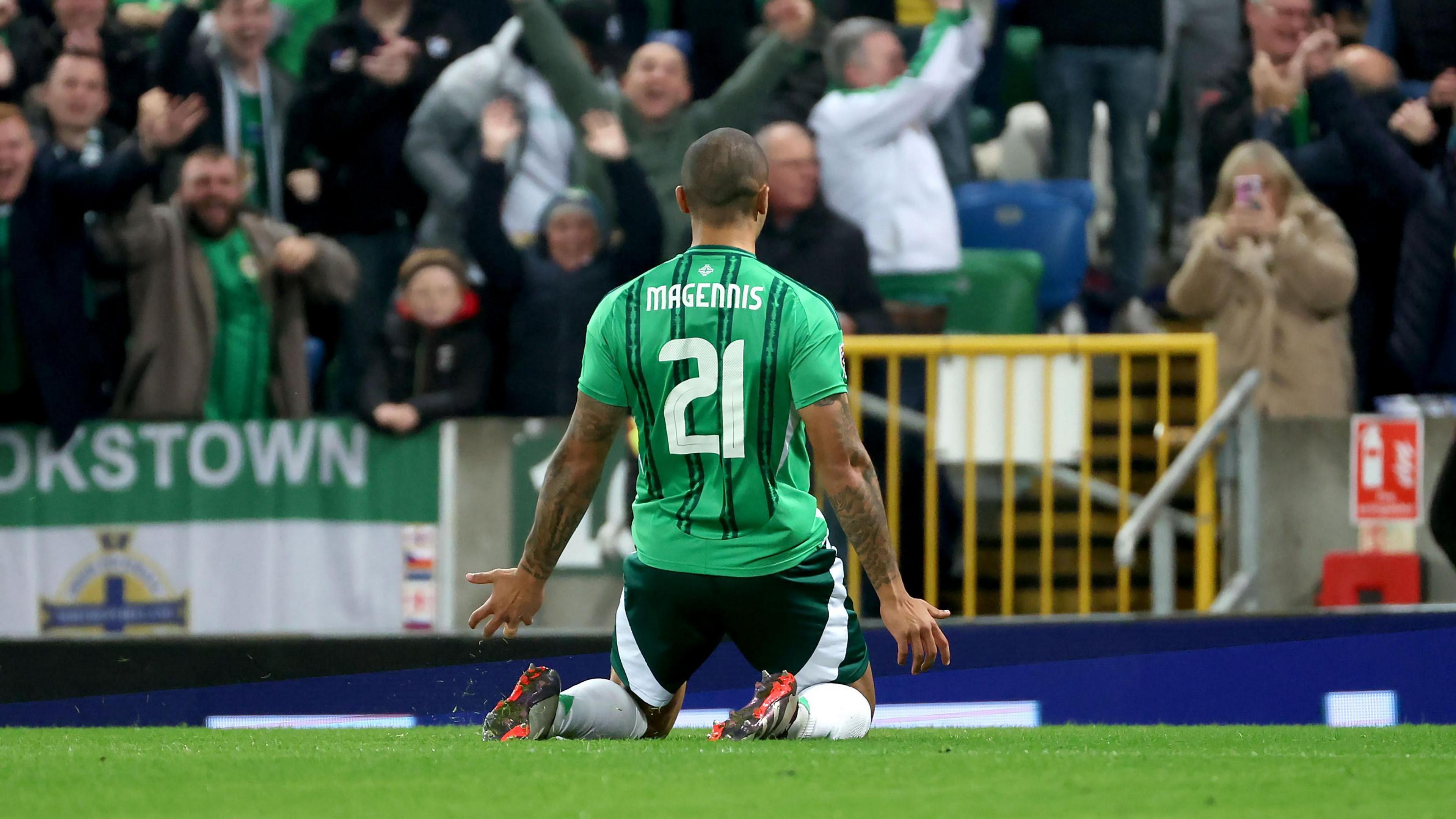 Josh Magennis celebrates