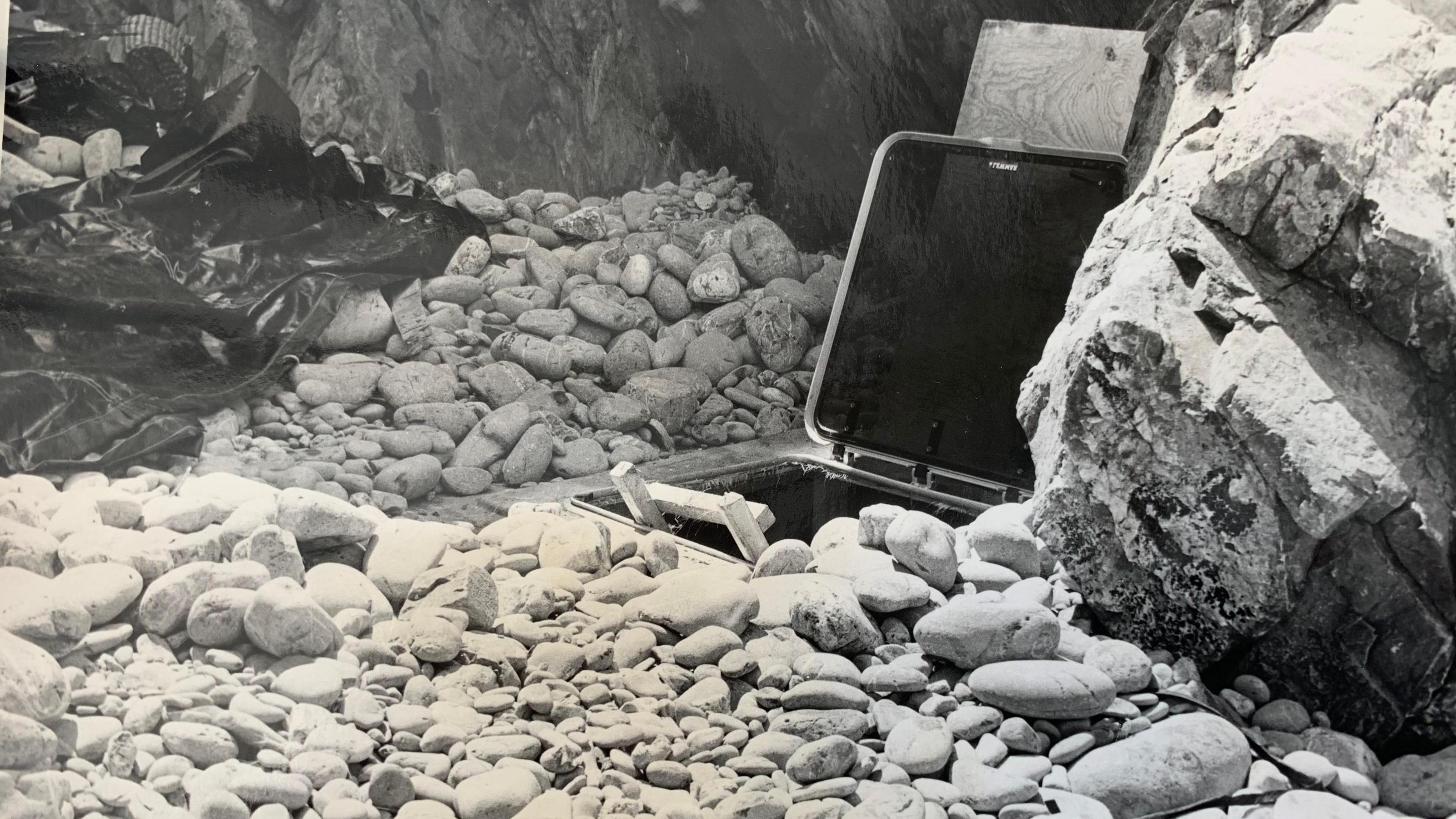 A hatch similar to one to a cabin on a boat has a ladder leading to the underground bunker on the remote bay.