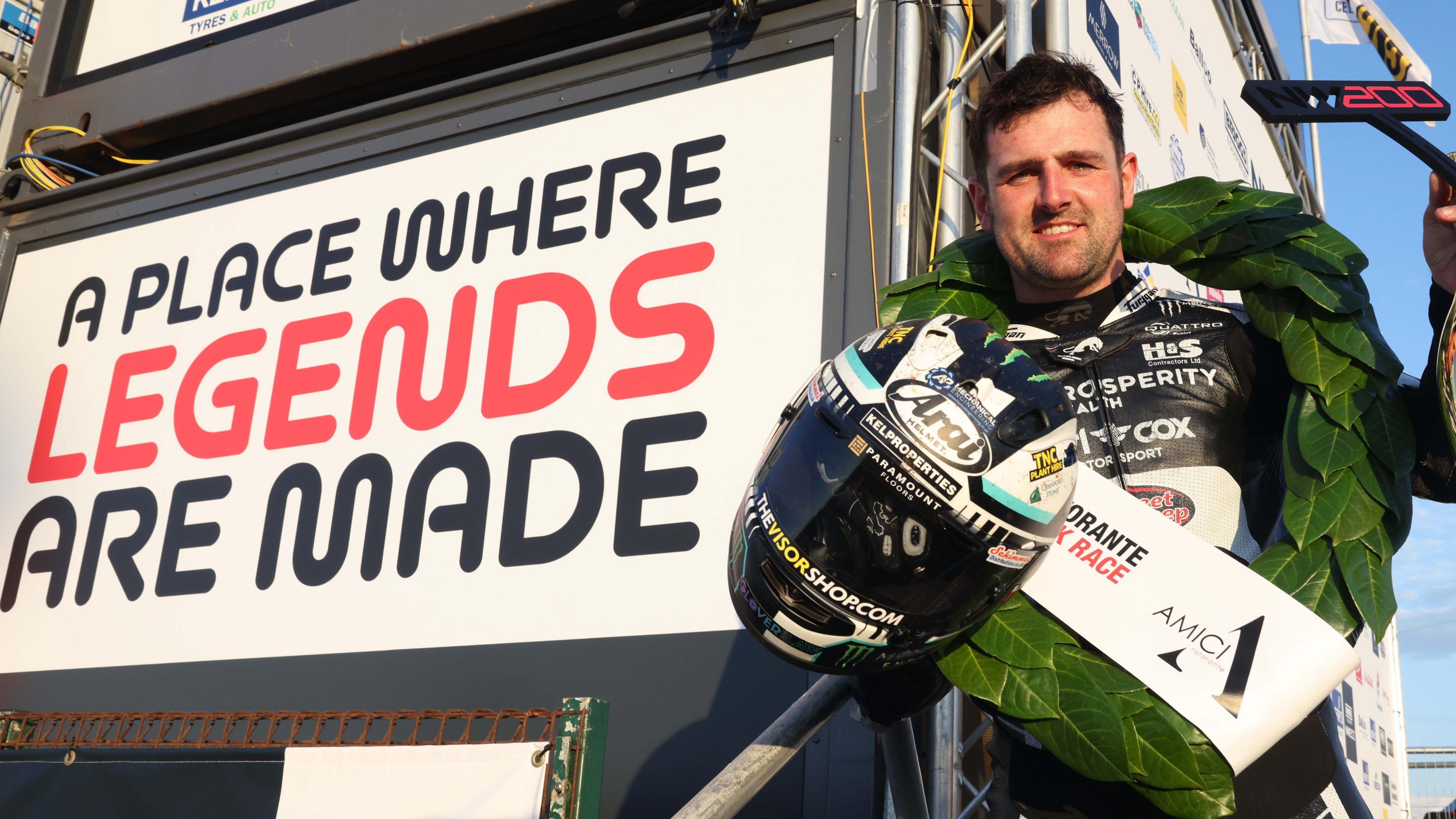 Michael Dunlop celebrates his Superstock victory