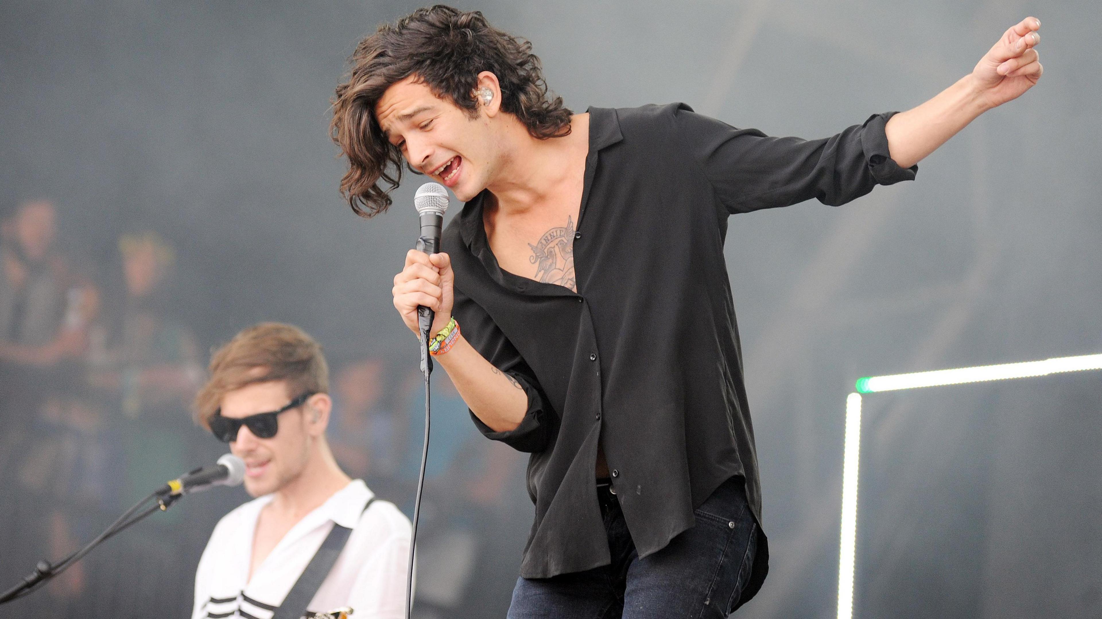Matty Healy on the stage at Glastonbury Festival from The 1975.