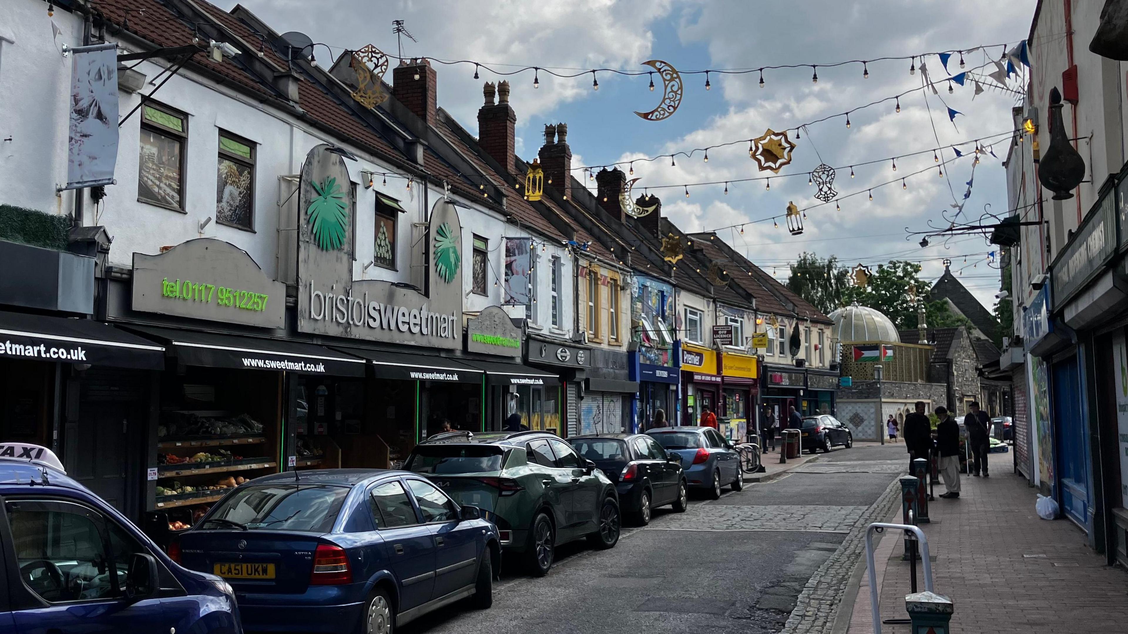 St Mark's Road, Bristol, with bunting draped between shops and cafes