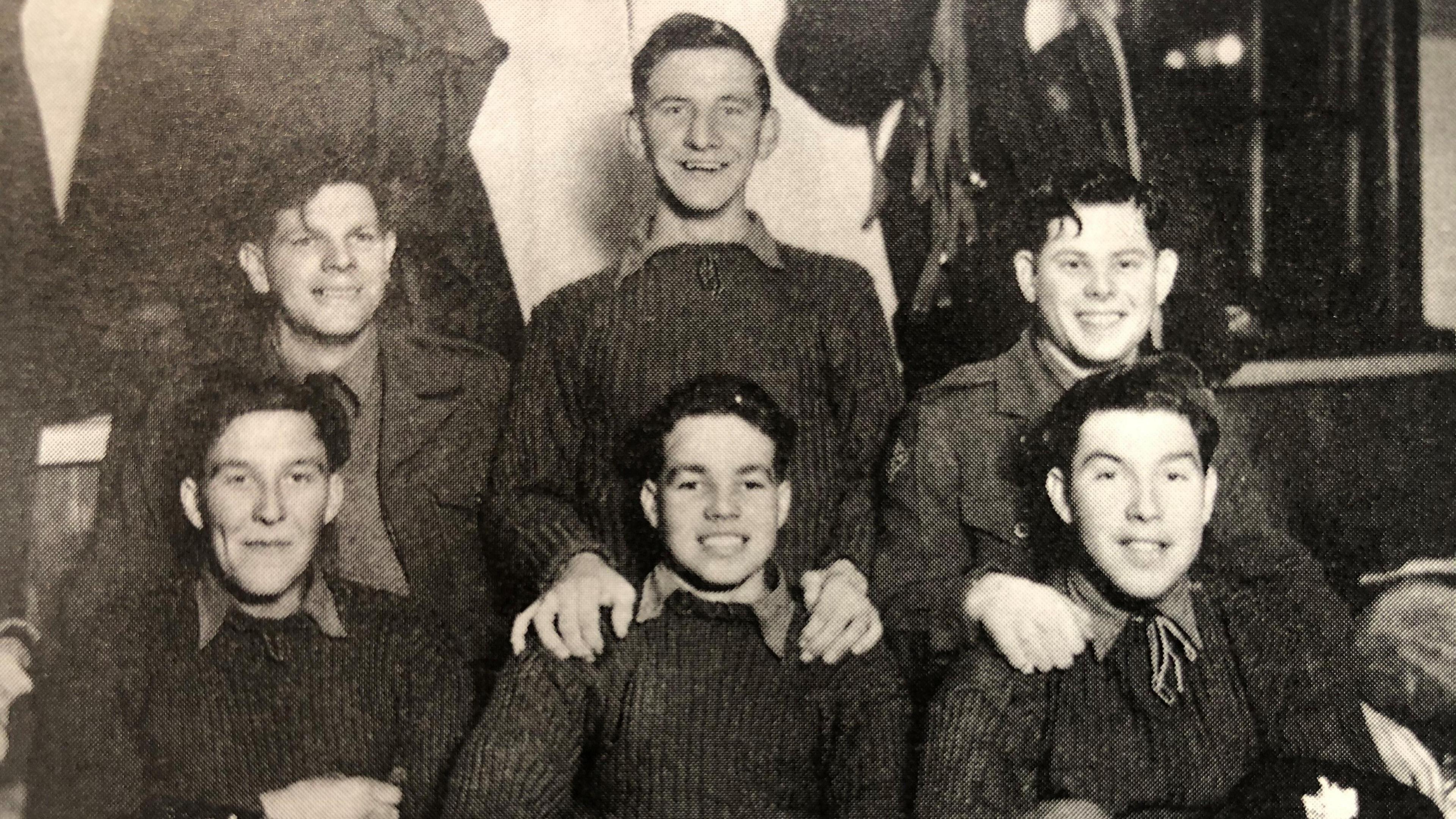 A black and white photograph of six young men. From back left: John Gazzard from Cinderford, Mick Turley from Ruspidge, John Sladen from Newnham. From front left: Davy Gardiner from Ruardean, Roy Mills from Cinderford and Bob Taylor from Coalway. 