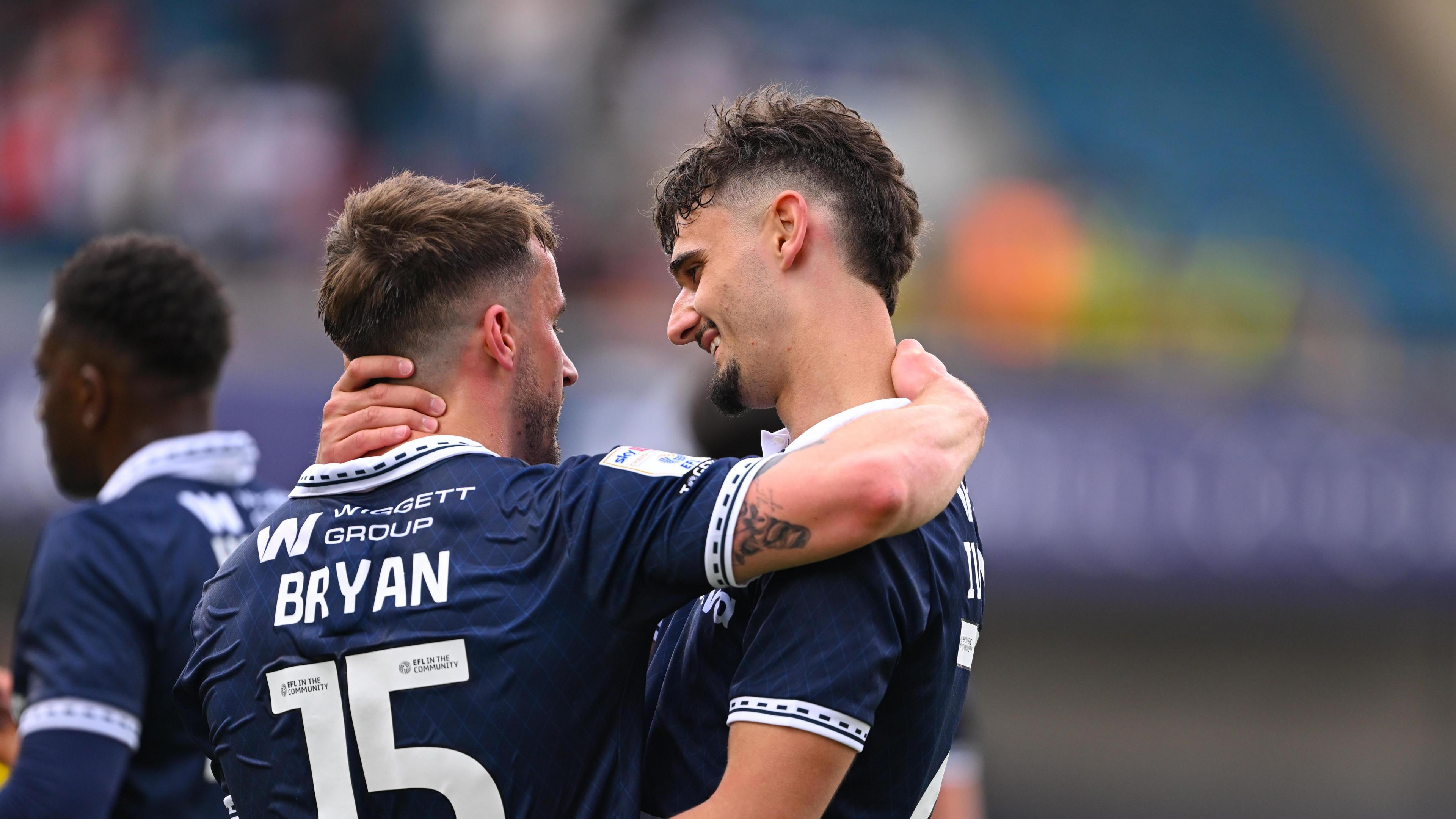 Mihailo Ivanovic and Joe Bryan hugging