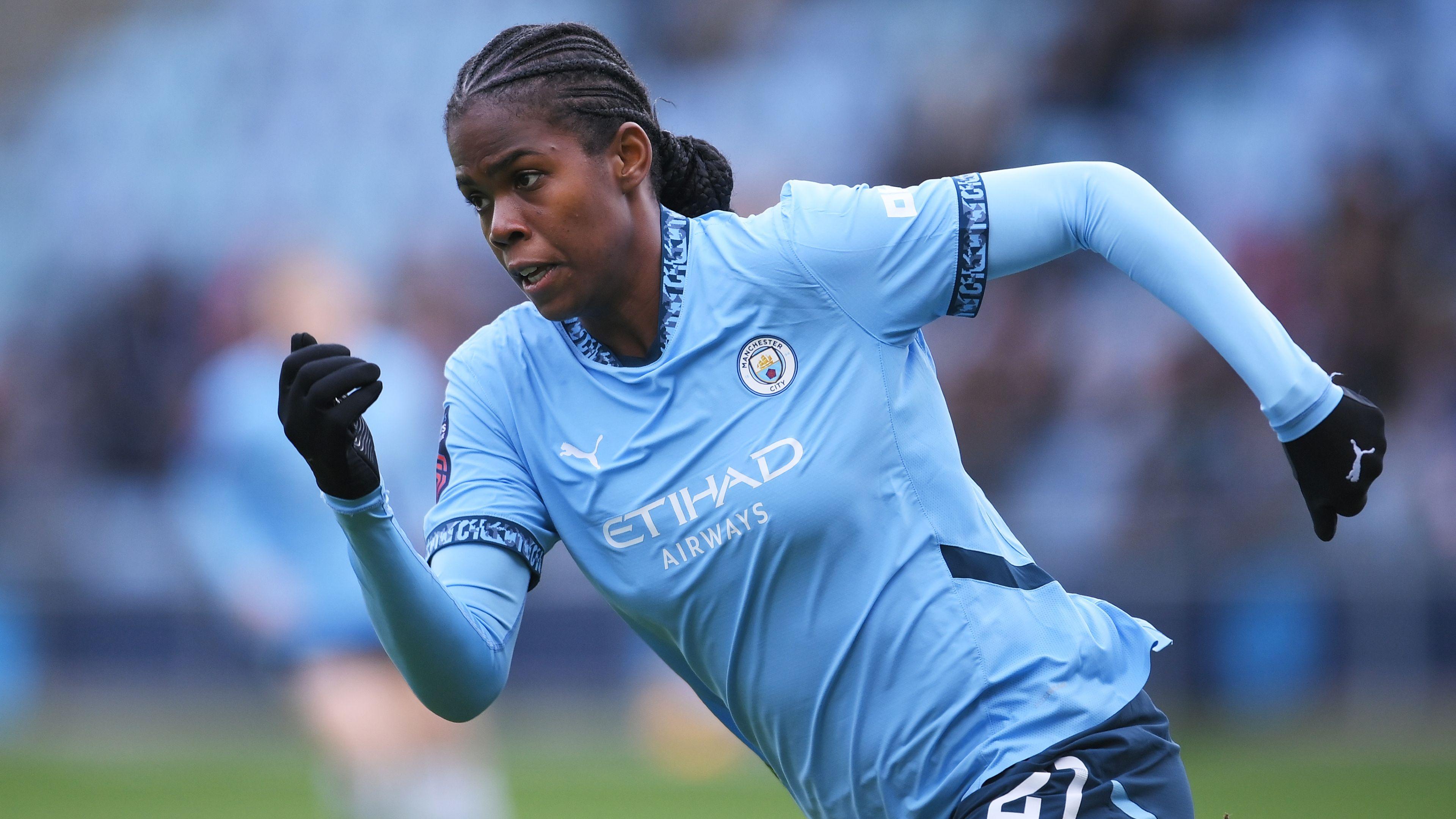 Manchester City's Khadija Shaw running while playing for Manchester City