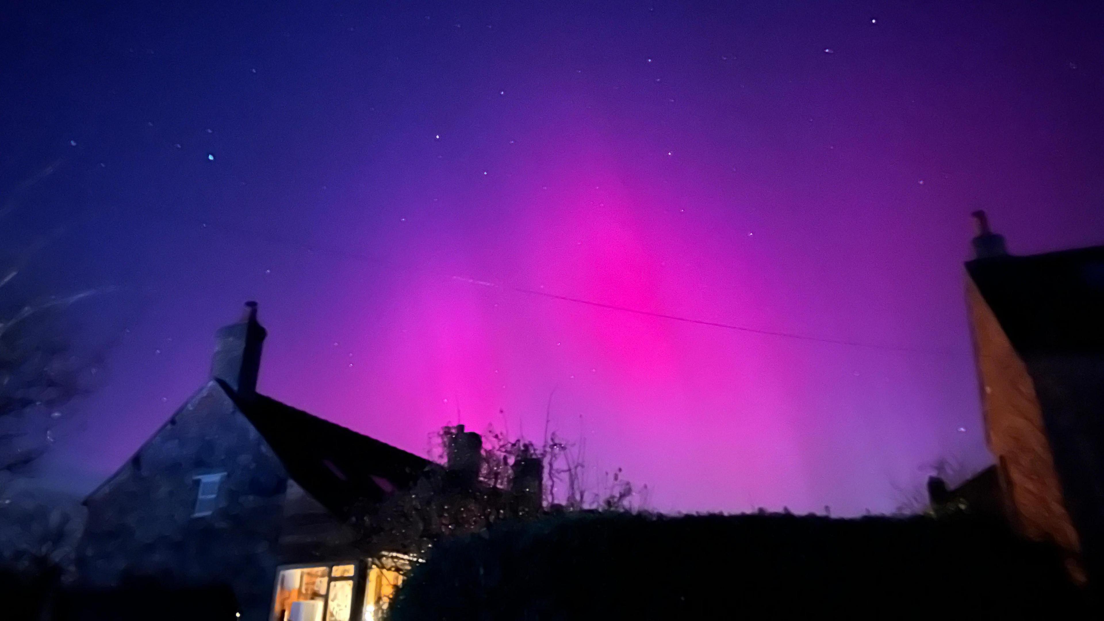 Pink northern lights over Ashbourne in Derbyshire