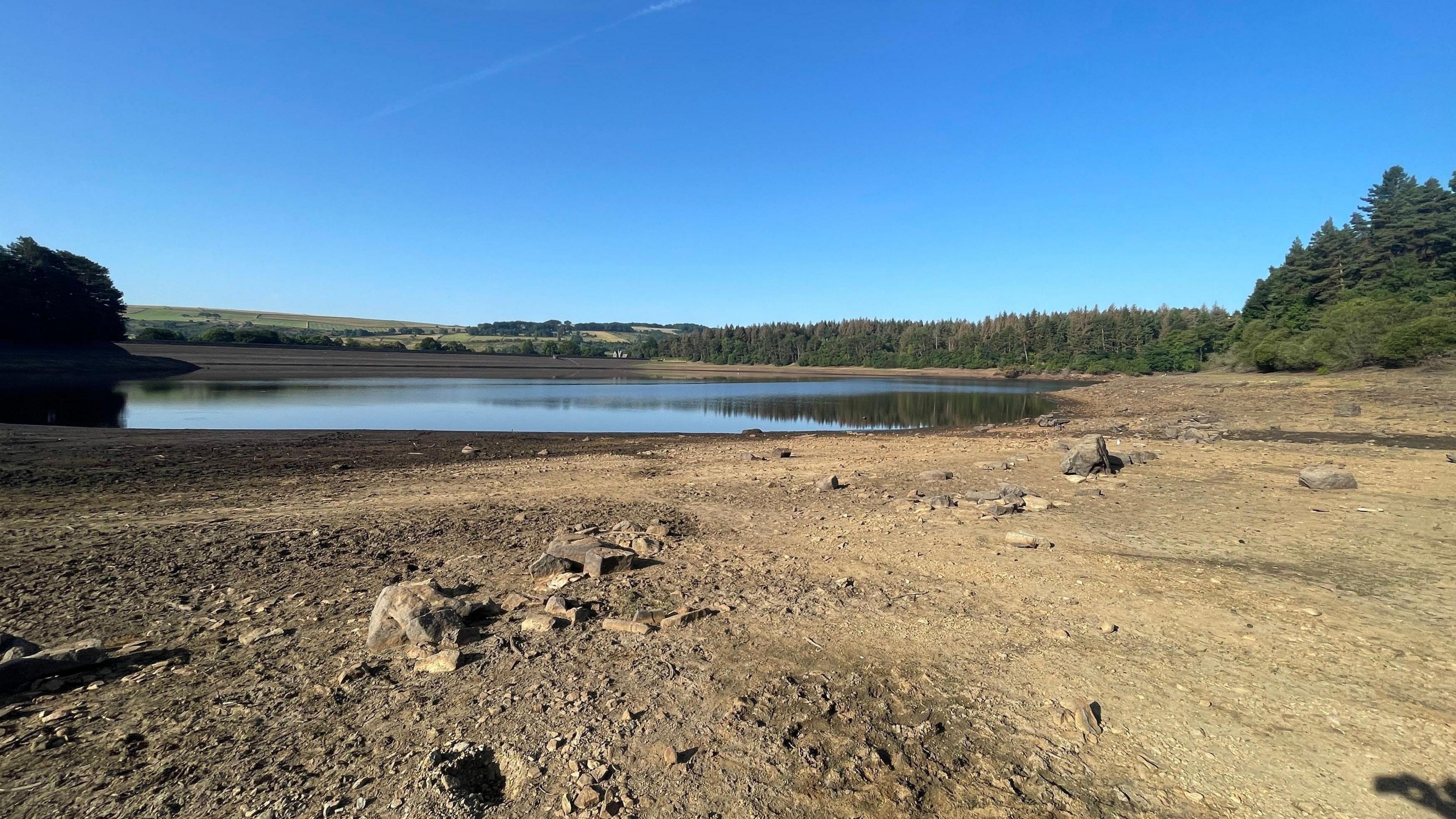 A photo of low water levels in a reservior