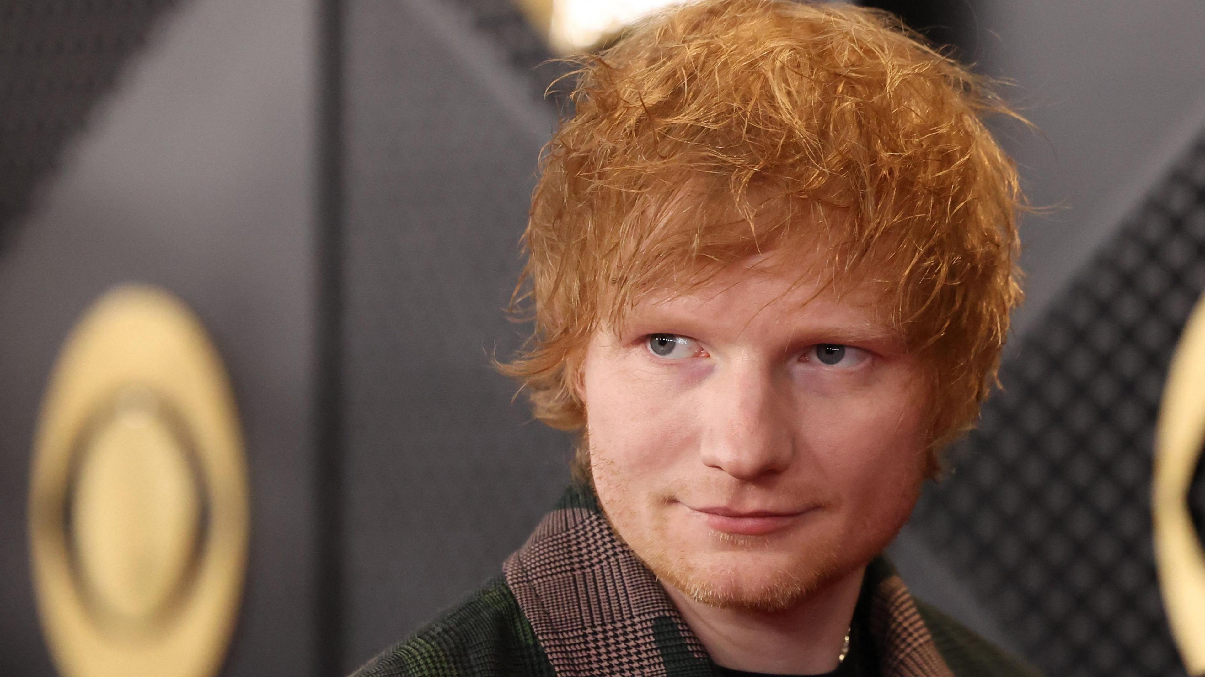 Ed Sheeran poses on the red carpet of the Grammy Awards in February 2024