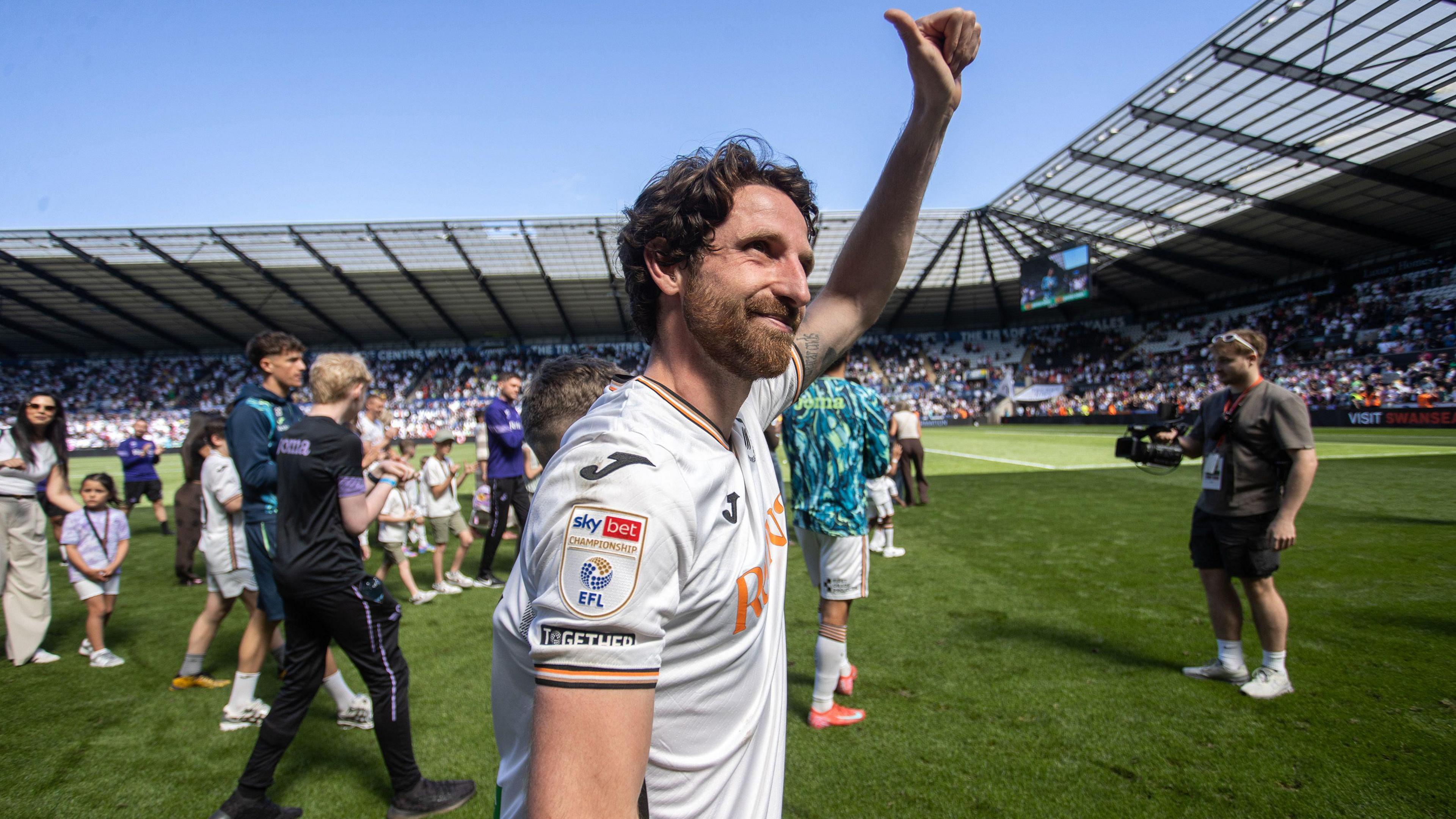 Joe Allen waves to Swansea fans