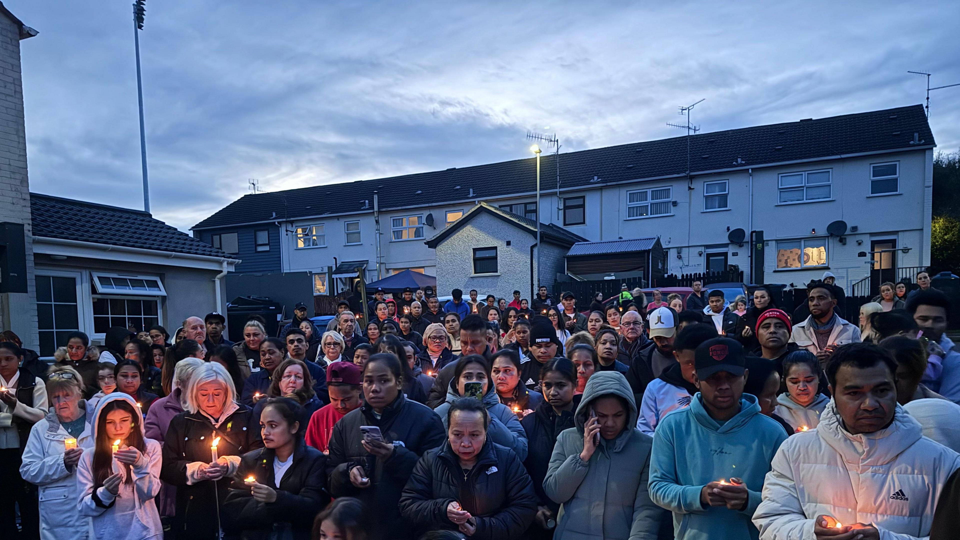 Crowds of people gathered some with lighted candles to remember the toddler who died in Dungannon last Sunday