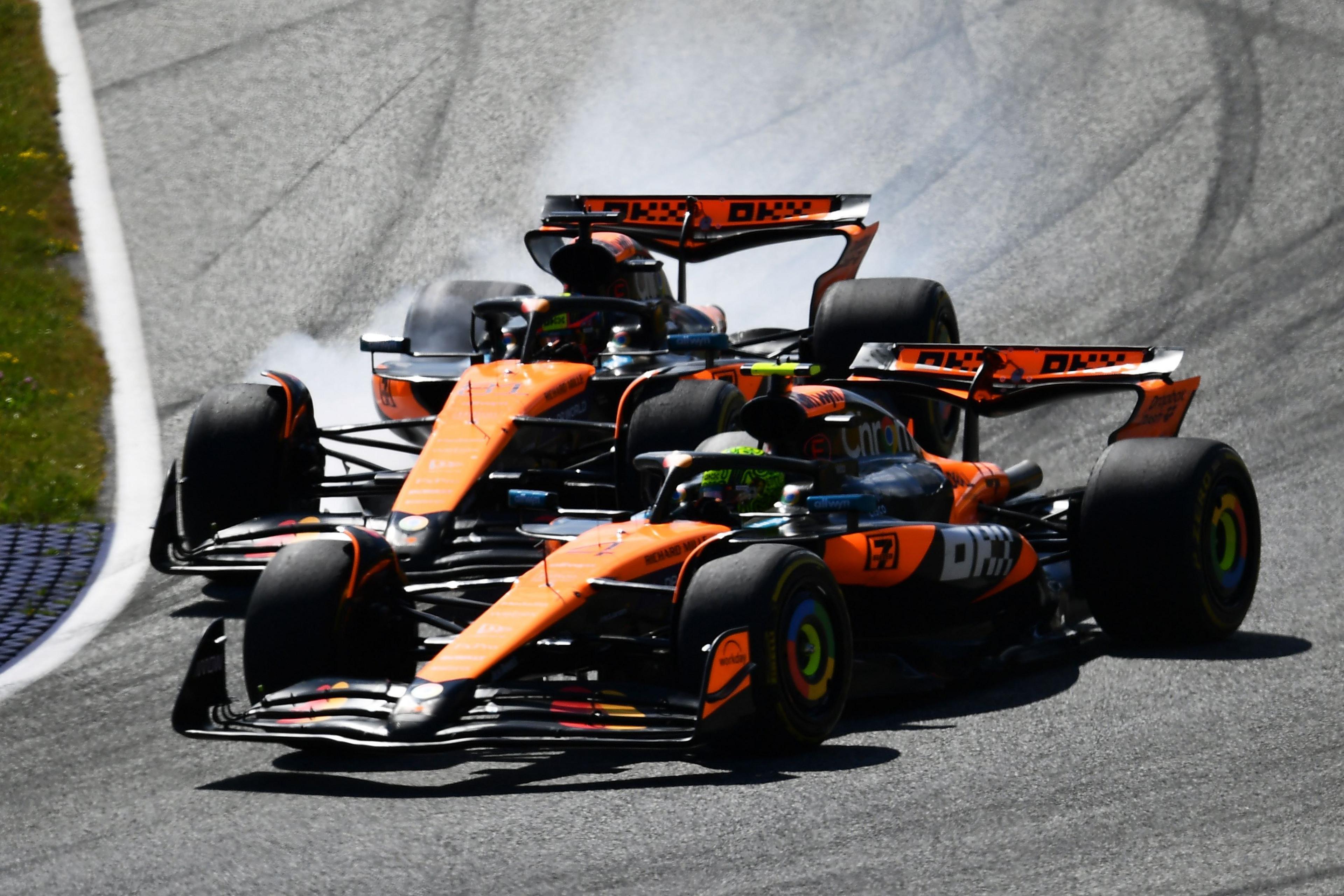 McLaren's Oscar Piastri locks up his brakes and nearly collides with McLaren team-mate Lando Norris during the Austrian Grand Prix