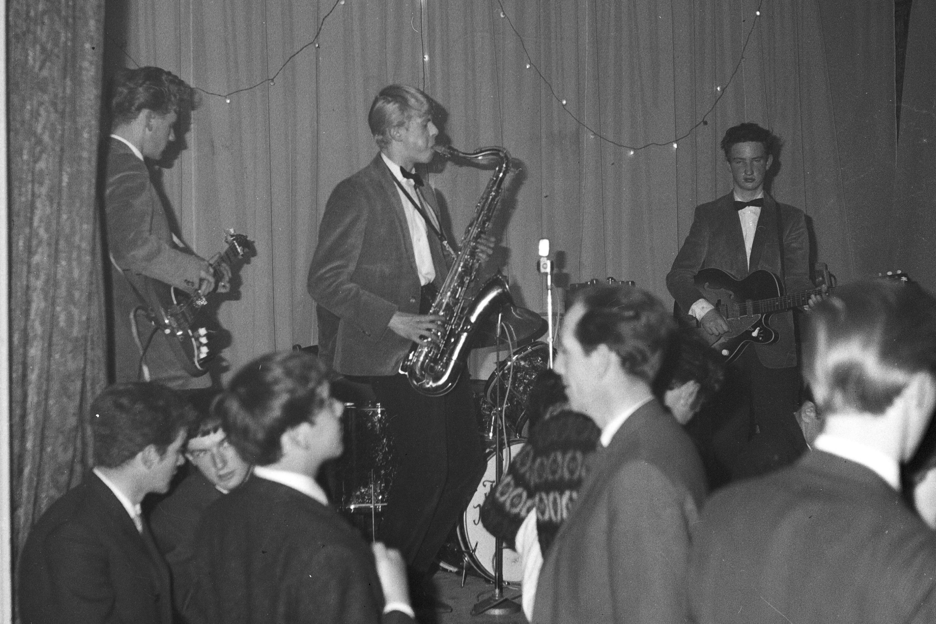 Black and white photo of David Jones (later David Bowie) playing saxophone with the Konrads in Biggin Hill