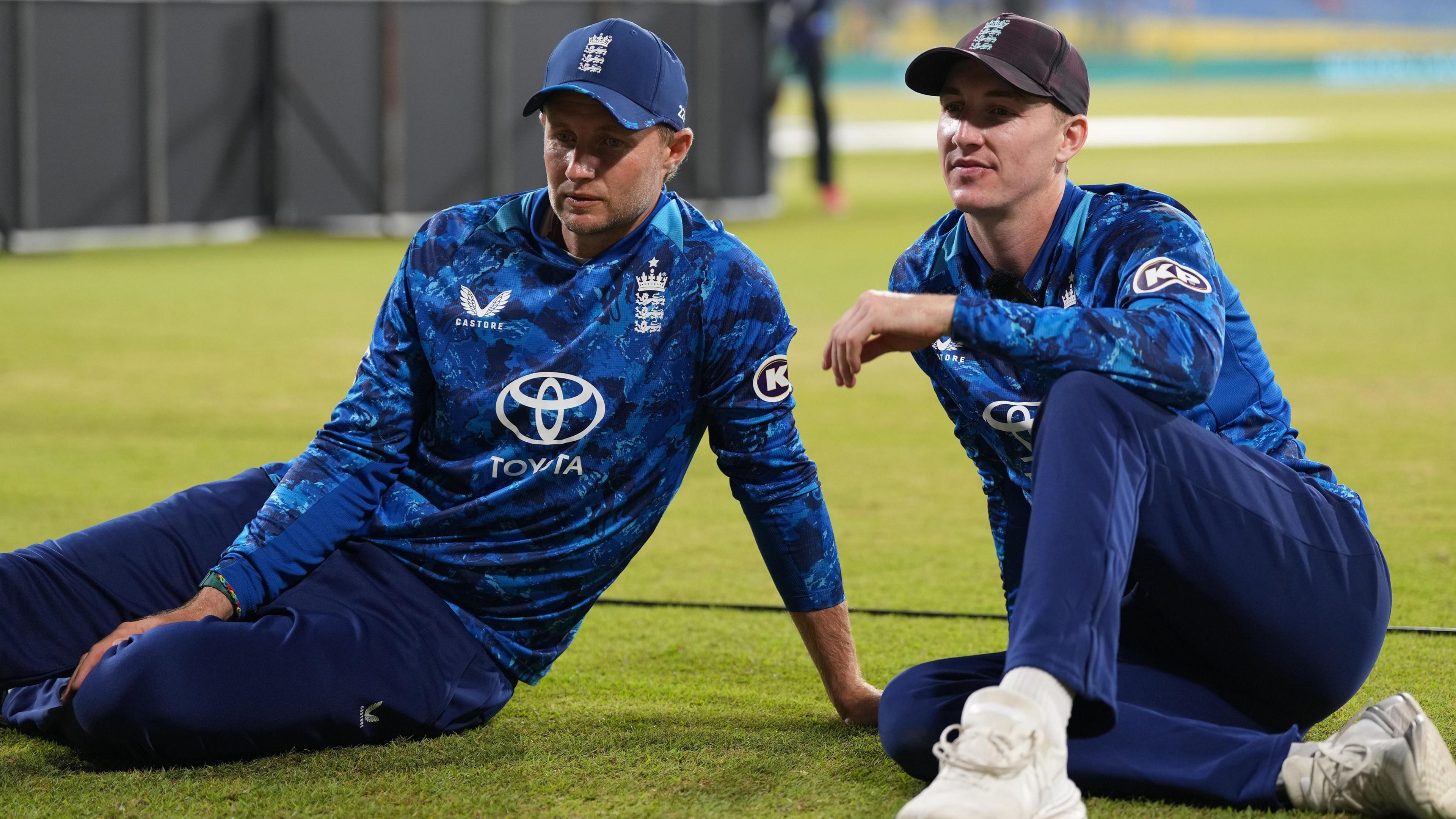Joe Root and Harry Brook sat on the outfield after the third one-day international against Sri Lanka