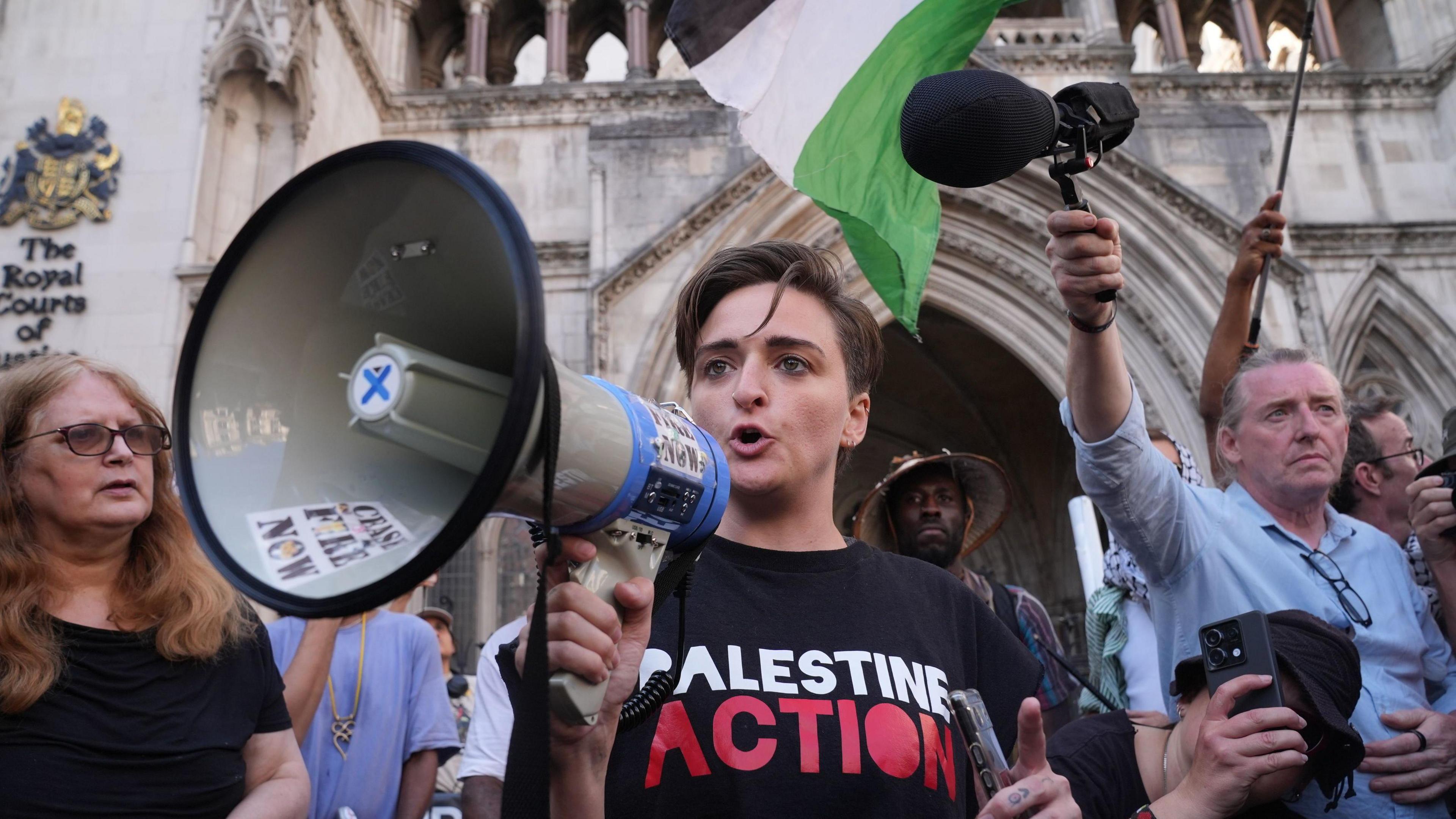Protesters outside the Royal Courts of Justice on The Strand, central London. 