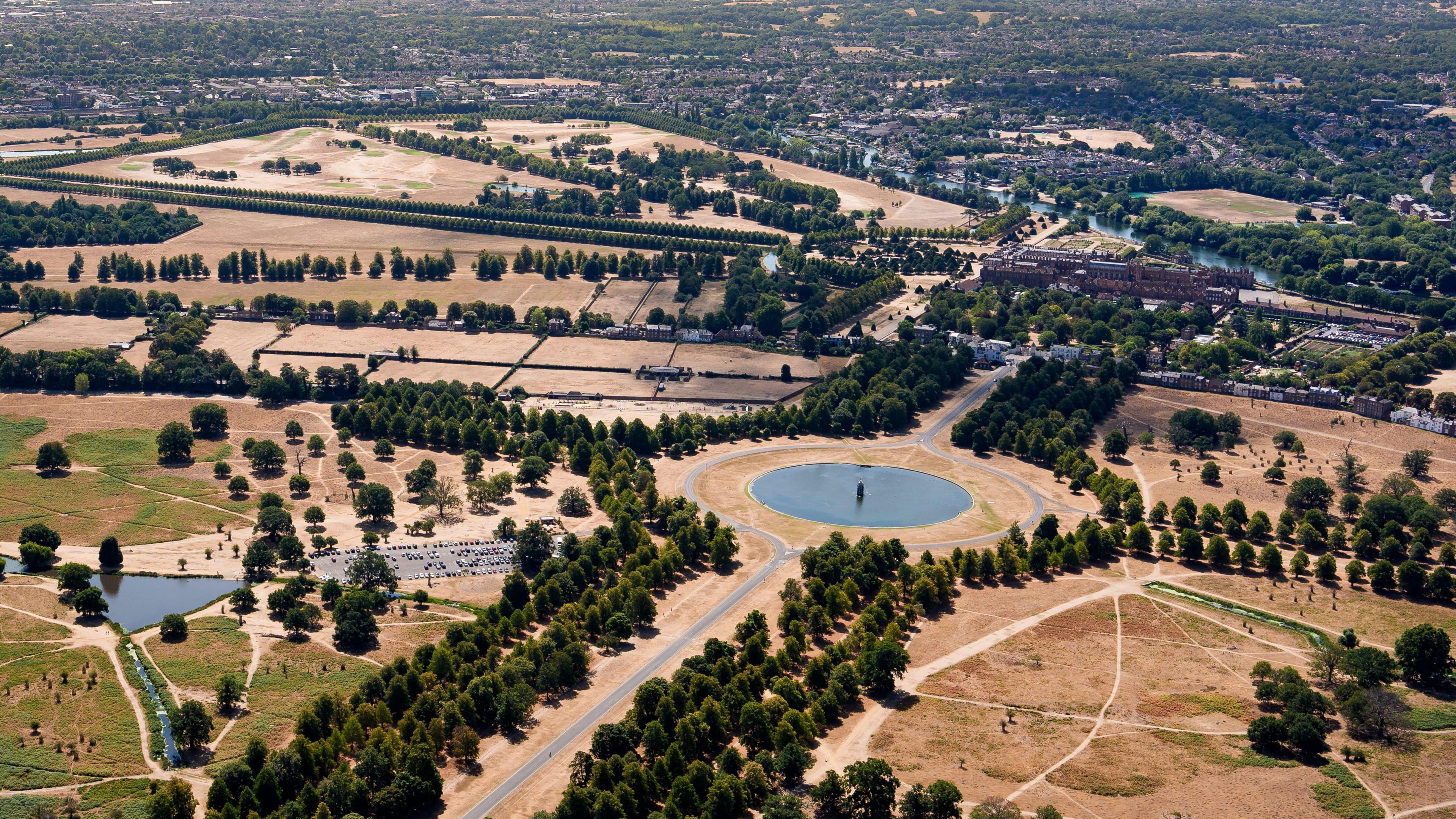 An aerial view of Hampton Court Palace and Bushy Park in East Molesey, Surrey