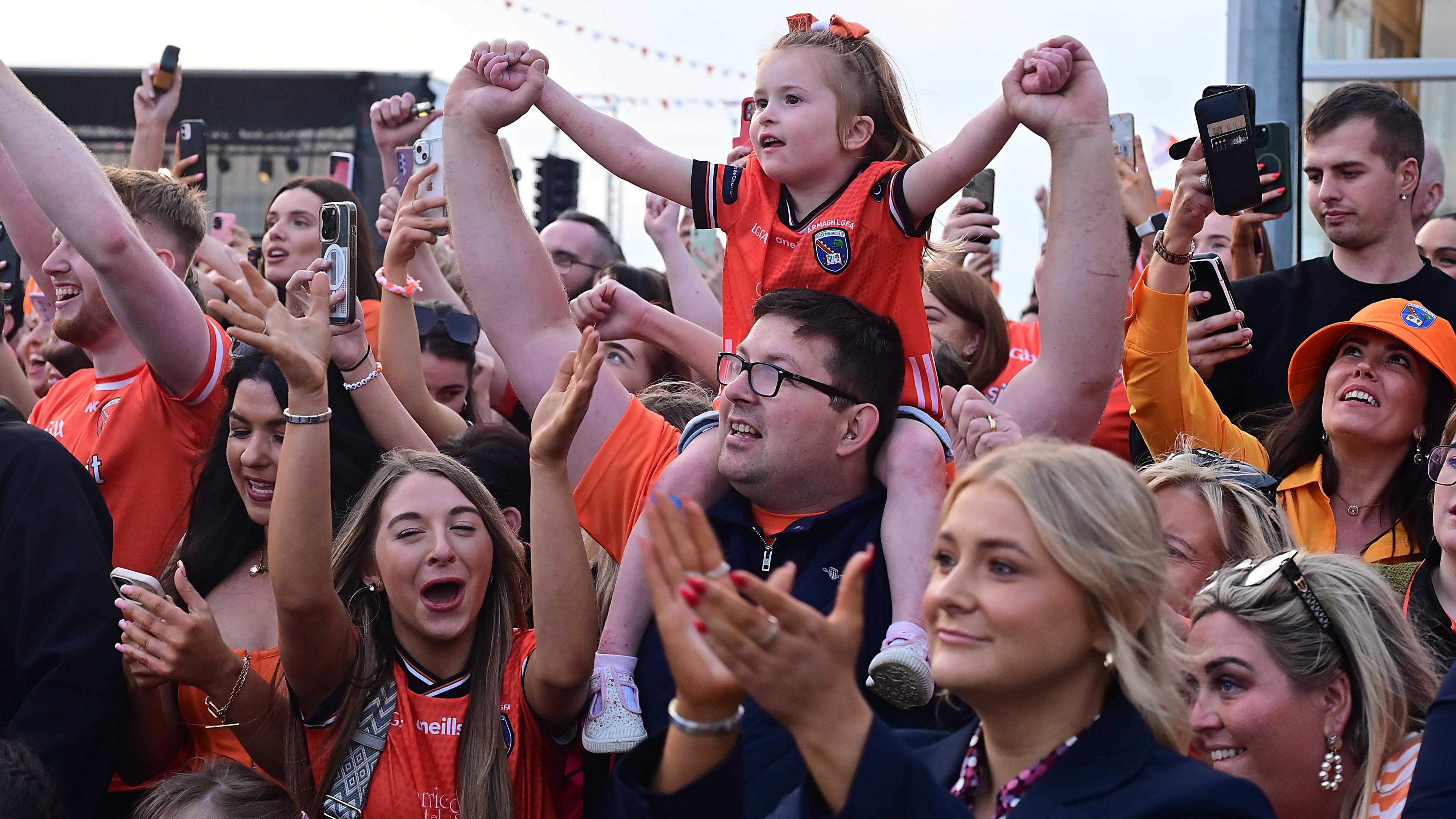 Fans cheer as the team arrive