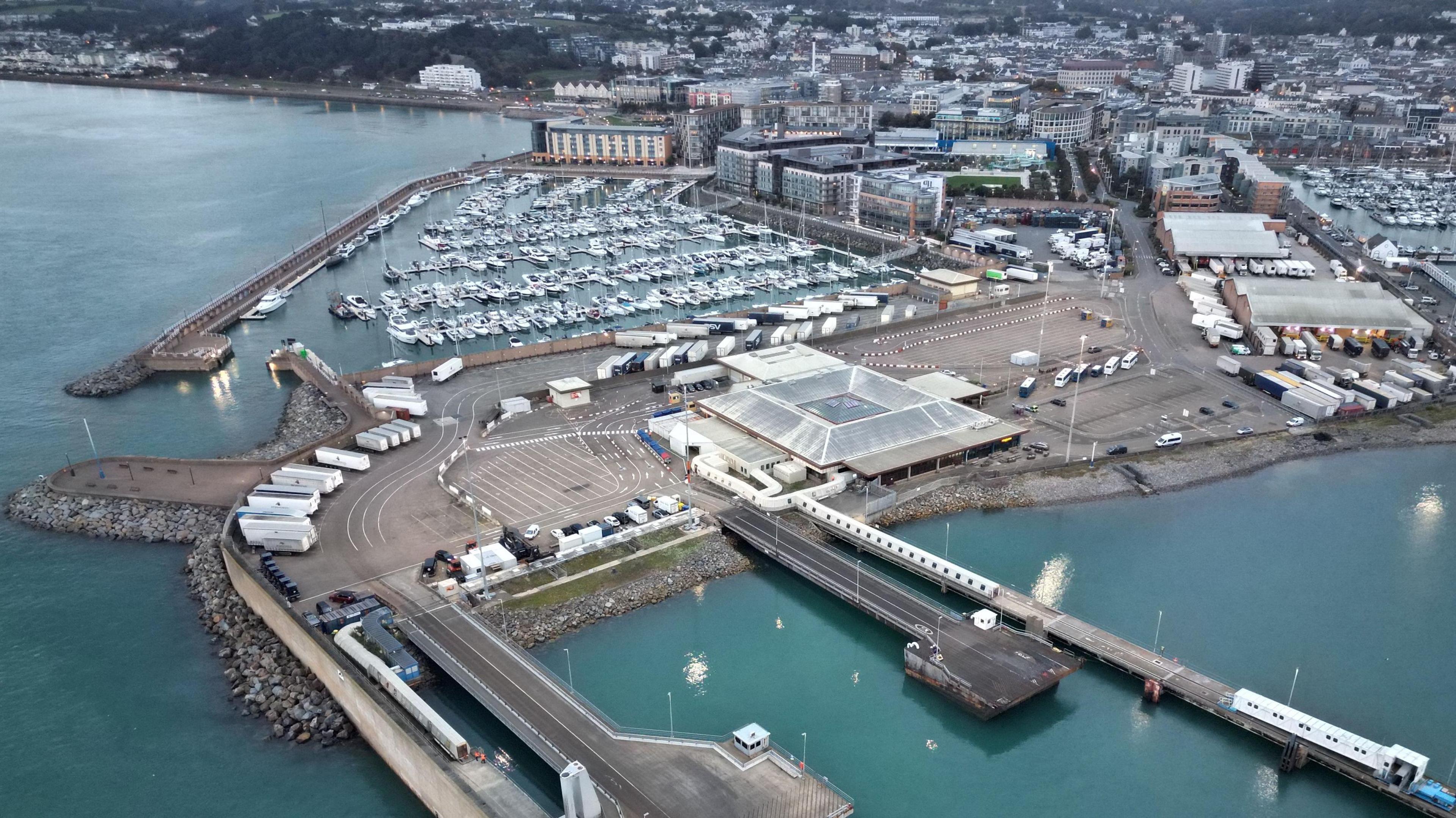 St Helier Harbour showing docks, boats and the terminal from above.