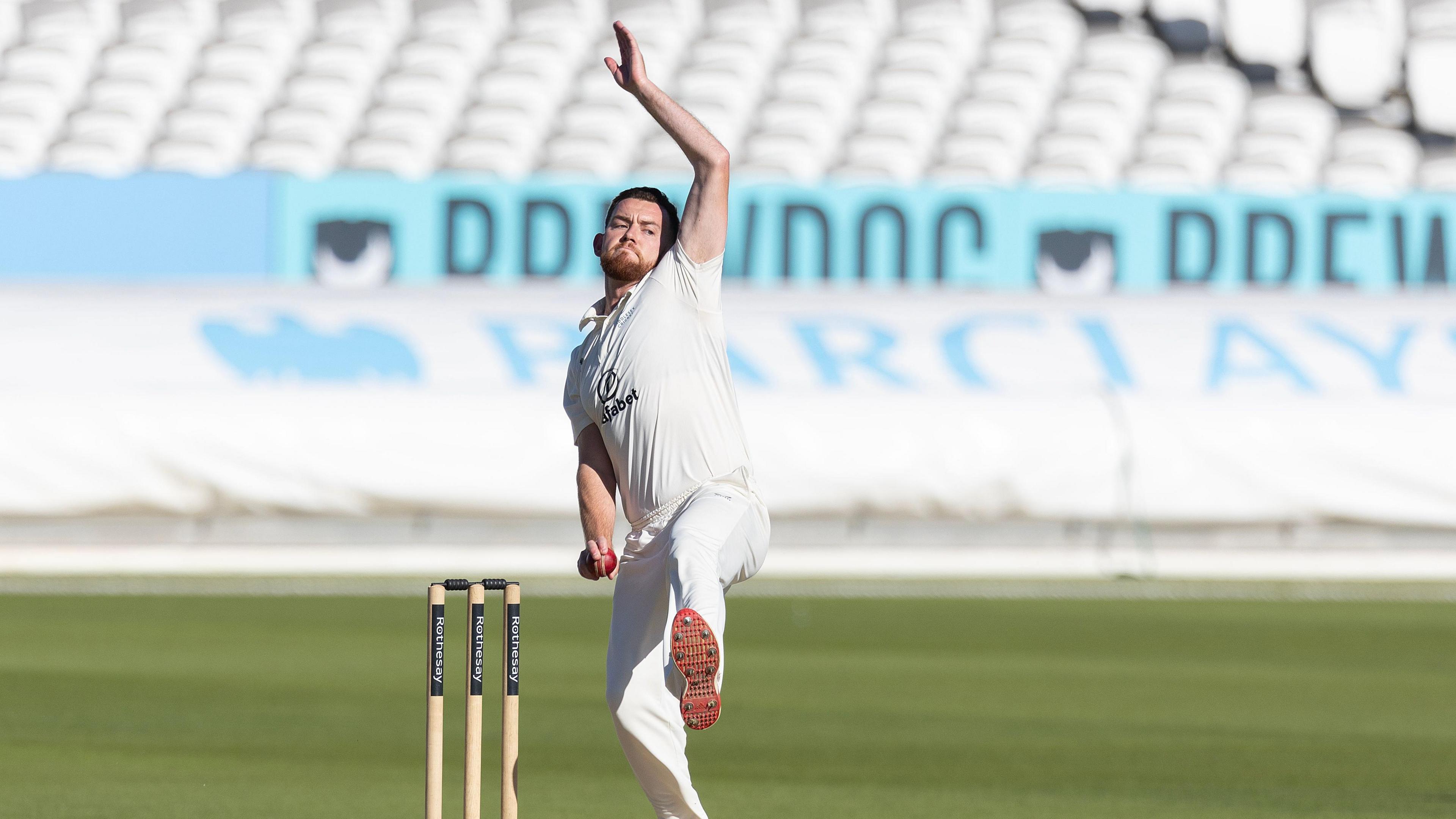Ryan Higgins in mid-delivery stride bowling for Middlesex against Gloucestershire at Lord's last season