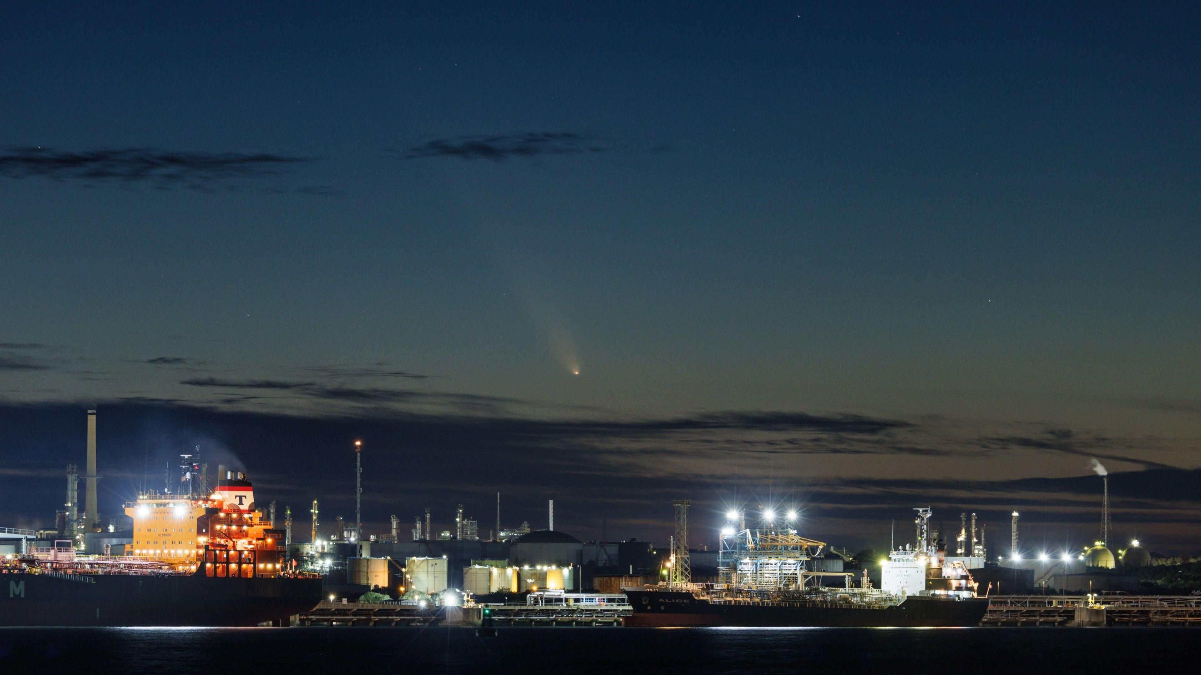 comet seen above ships docked in Java.