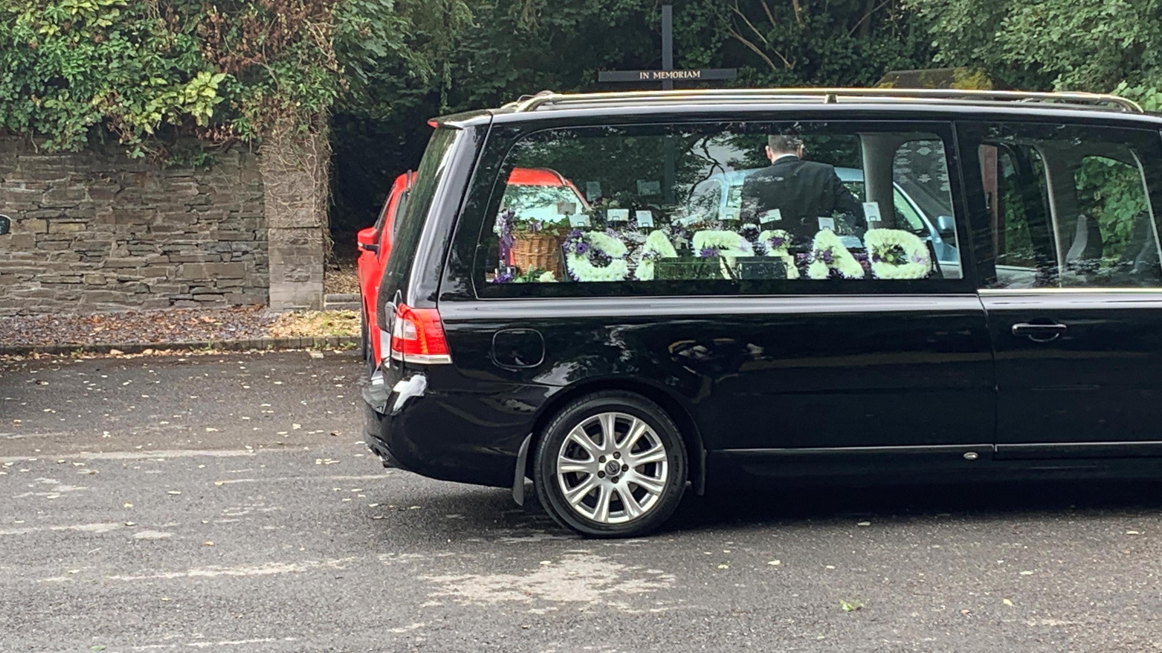 Funeral car with flowers inside