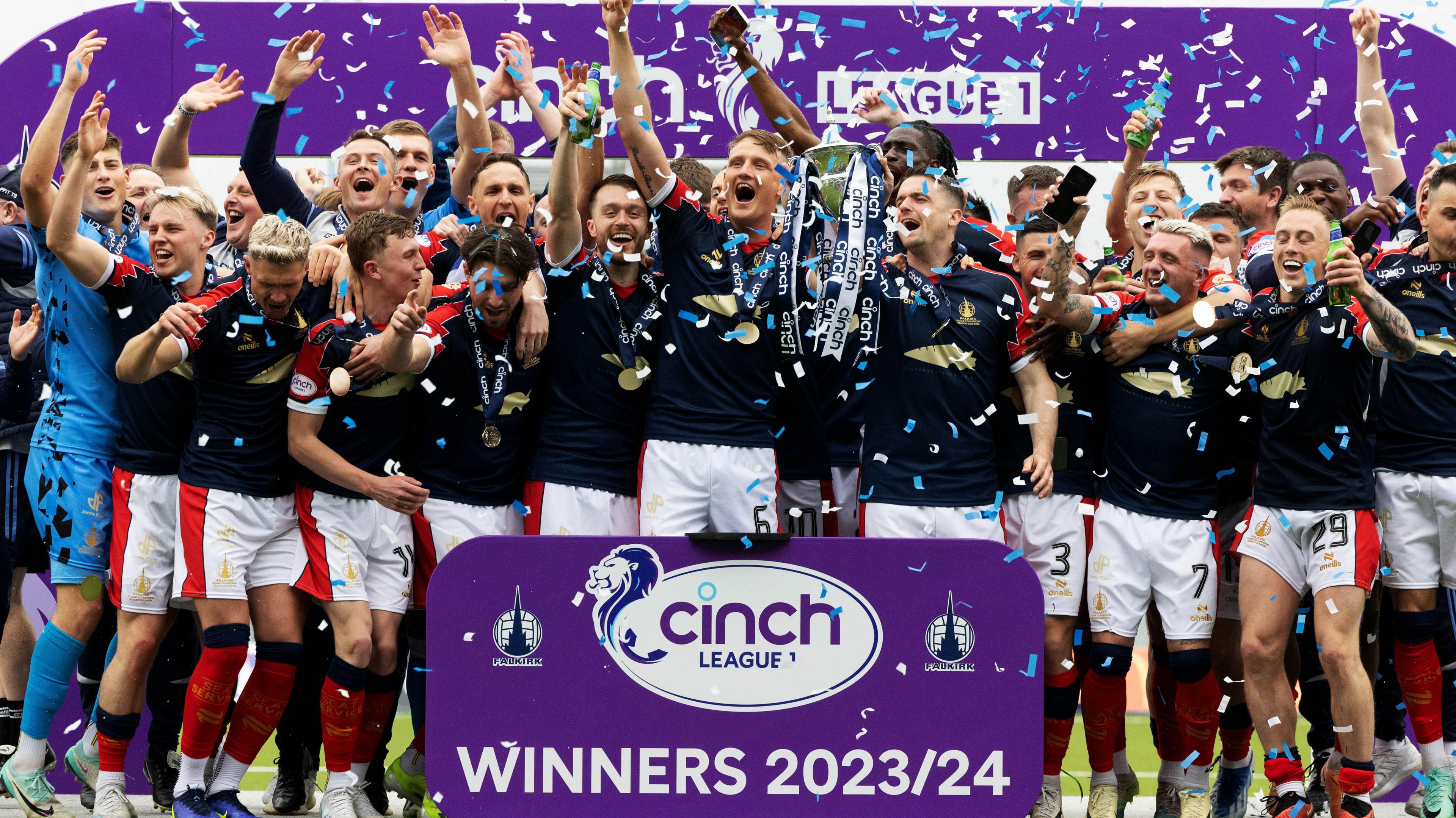 Falkirk's Stephen McGinn and Coll Donaldson lift the League One Trophy