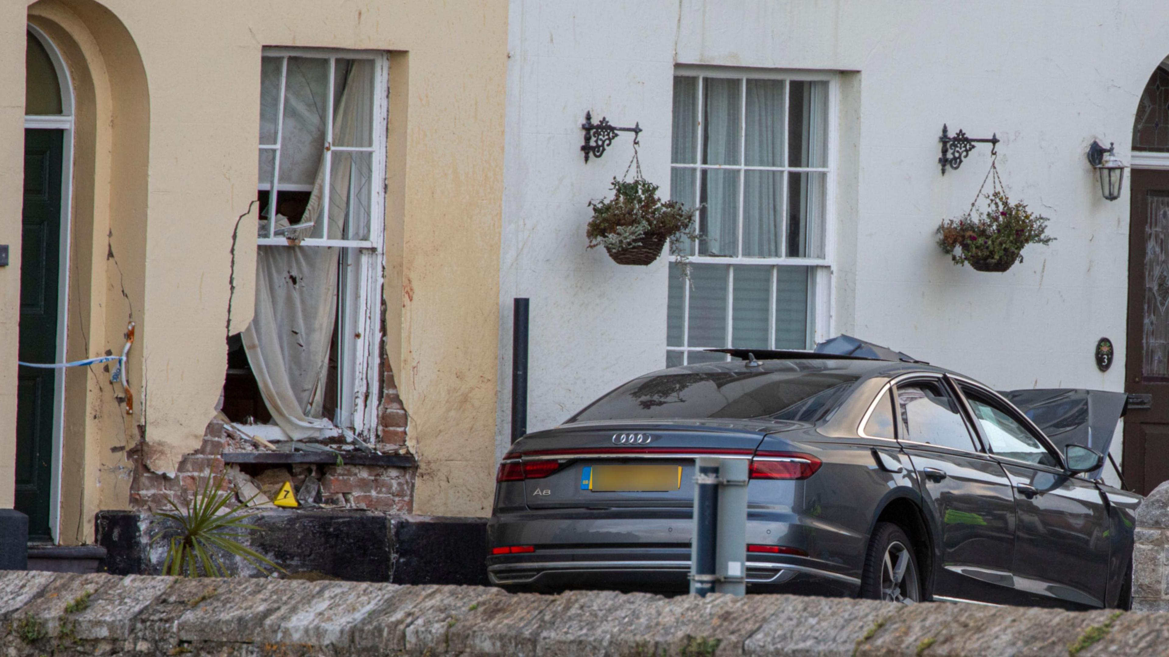 The house and car involved in the collision