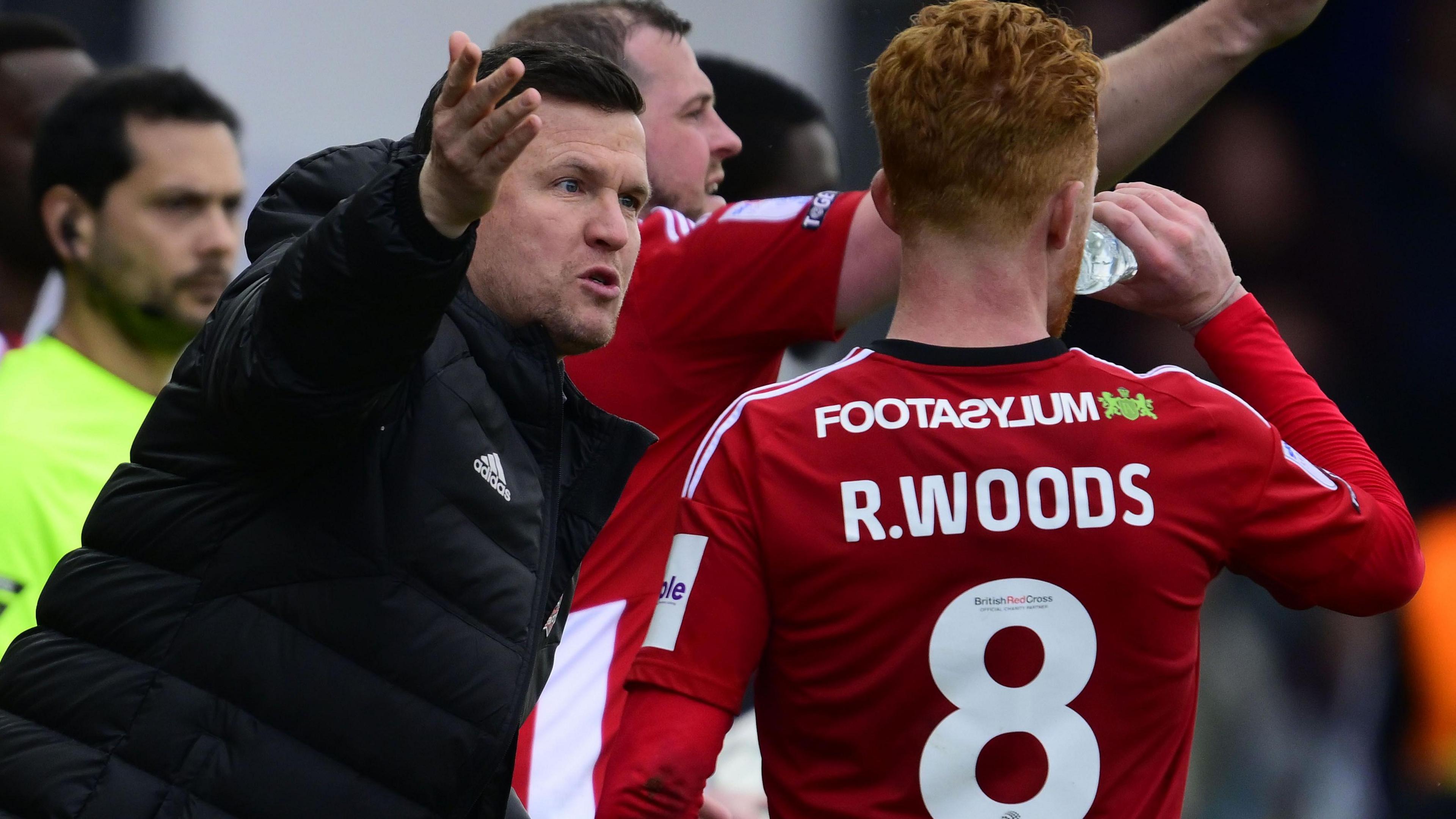 Gary Caldwell gives instructions to Ryan Woods