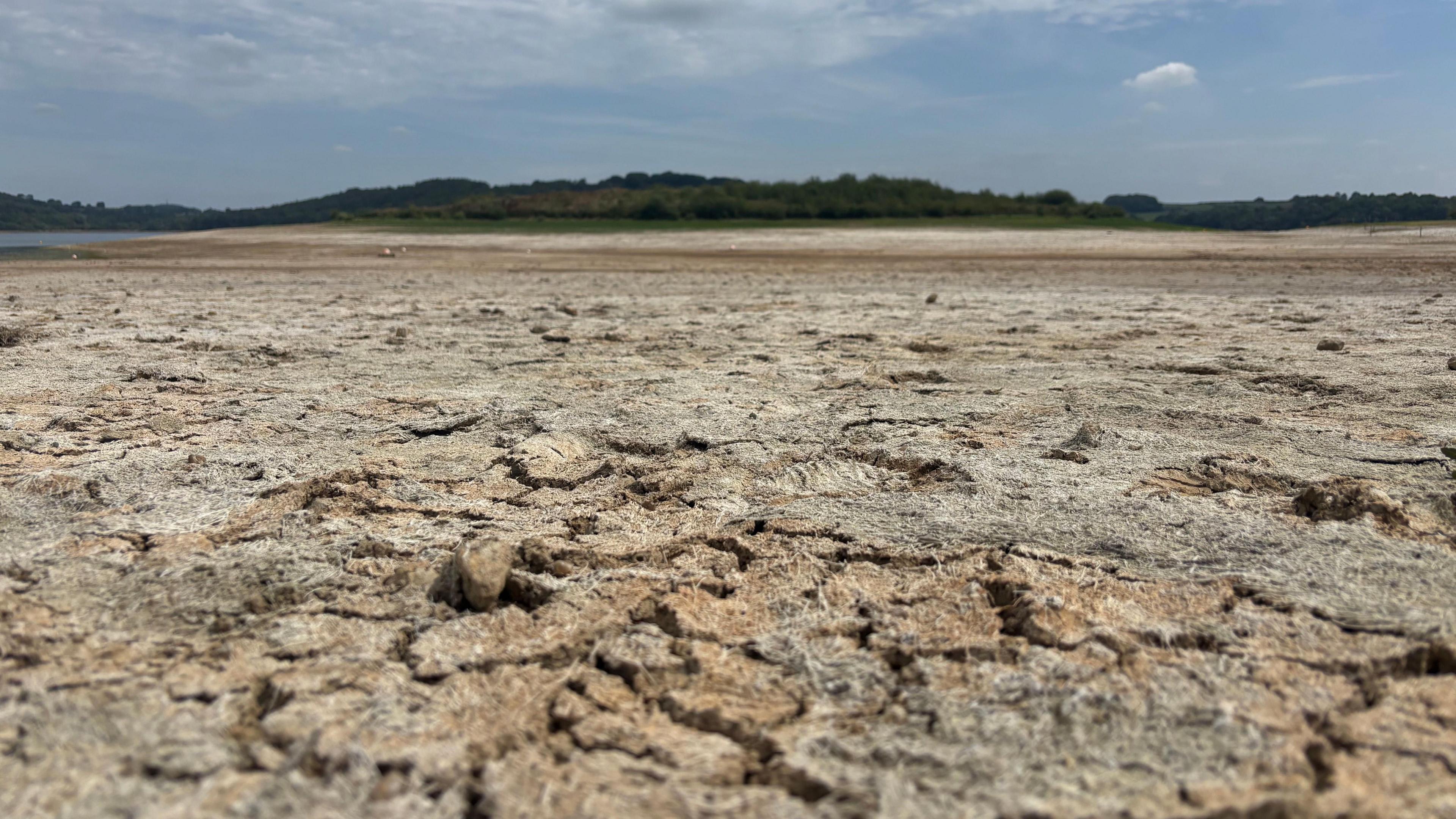 Carsington Water reservoir is pictured and is dry and cracking