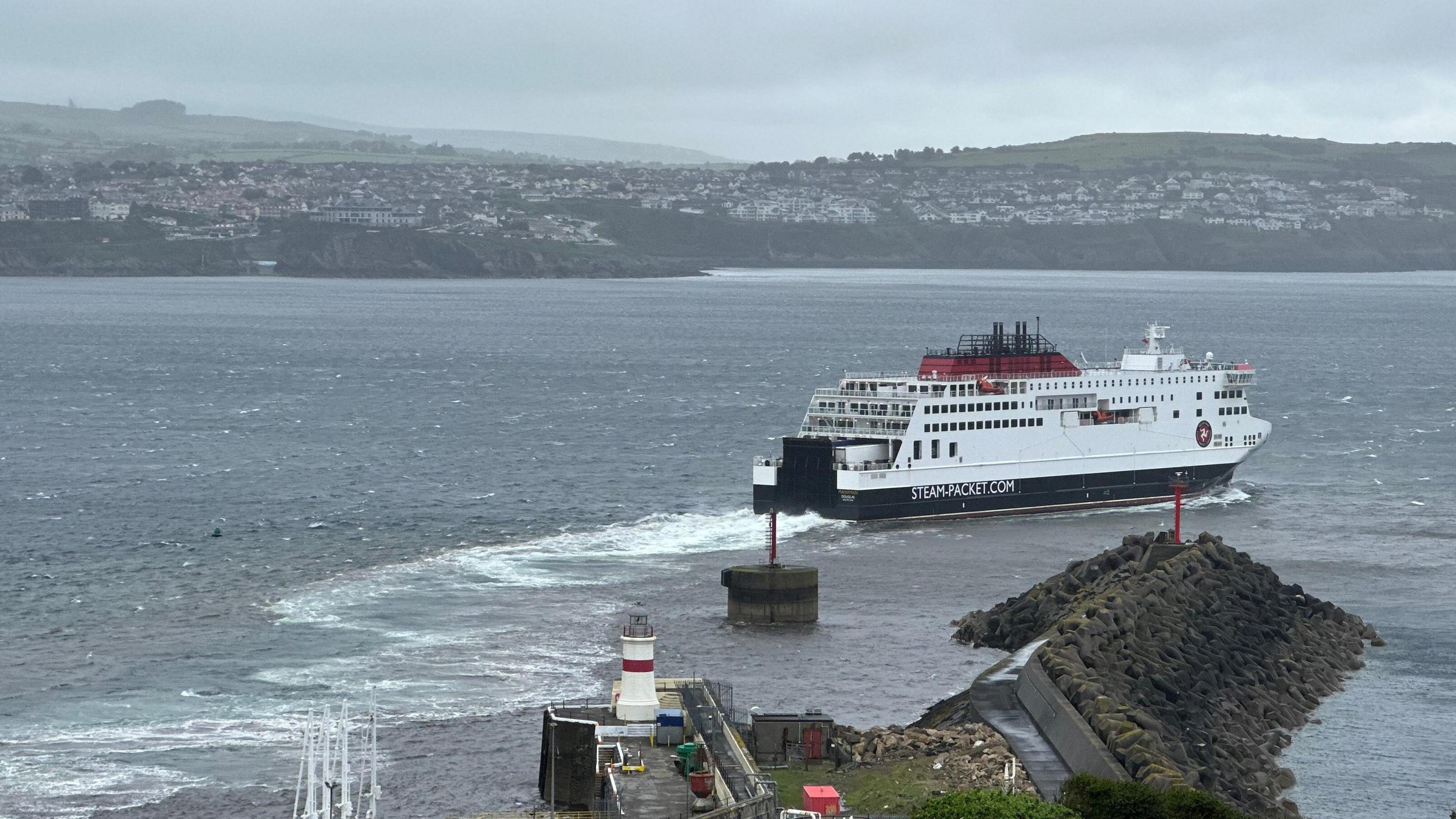 Ferry Manxman sailing out of Douglas Harbour past the breakwater