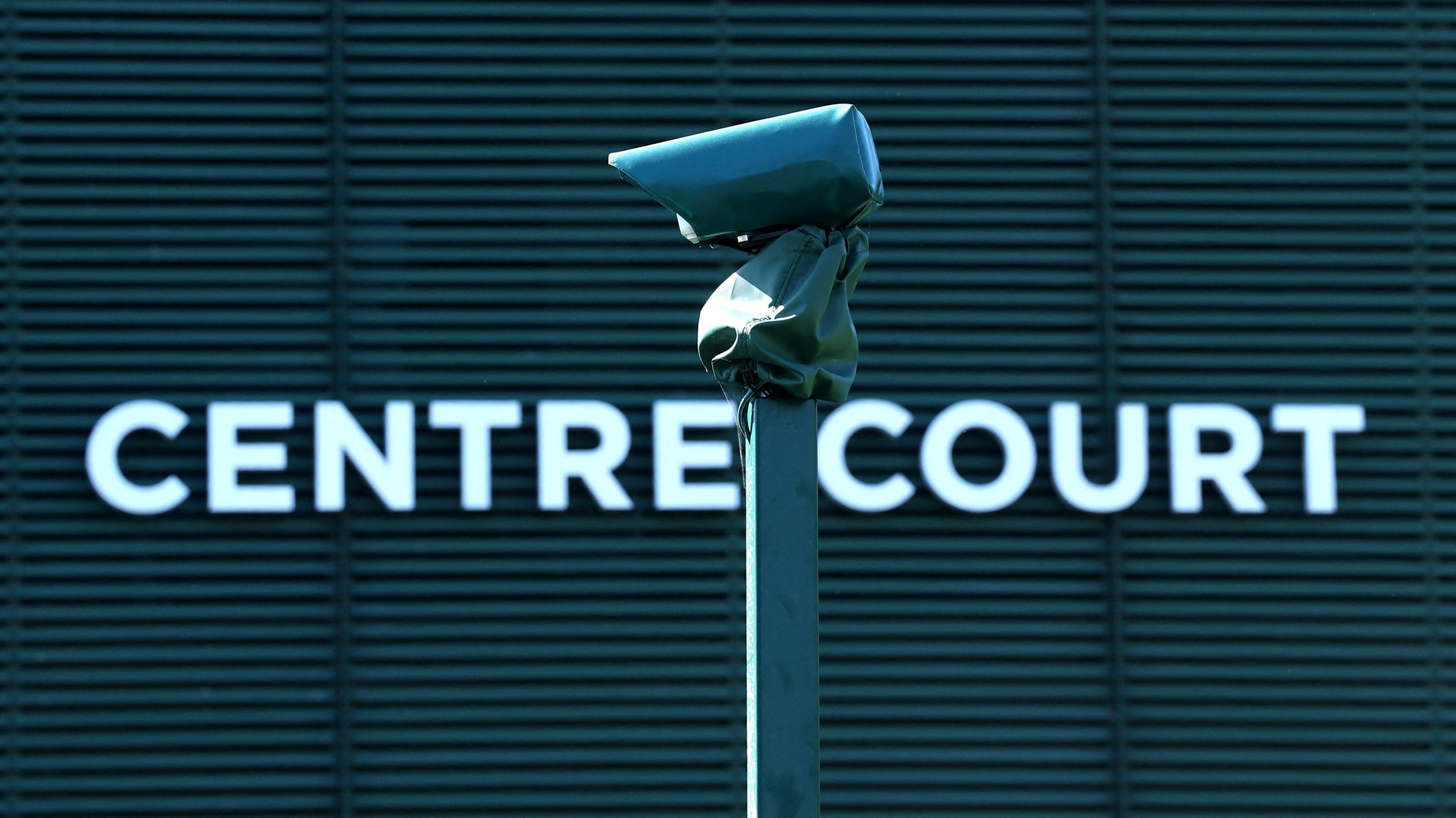 A line camera is pictured with Centre Court in the background
