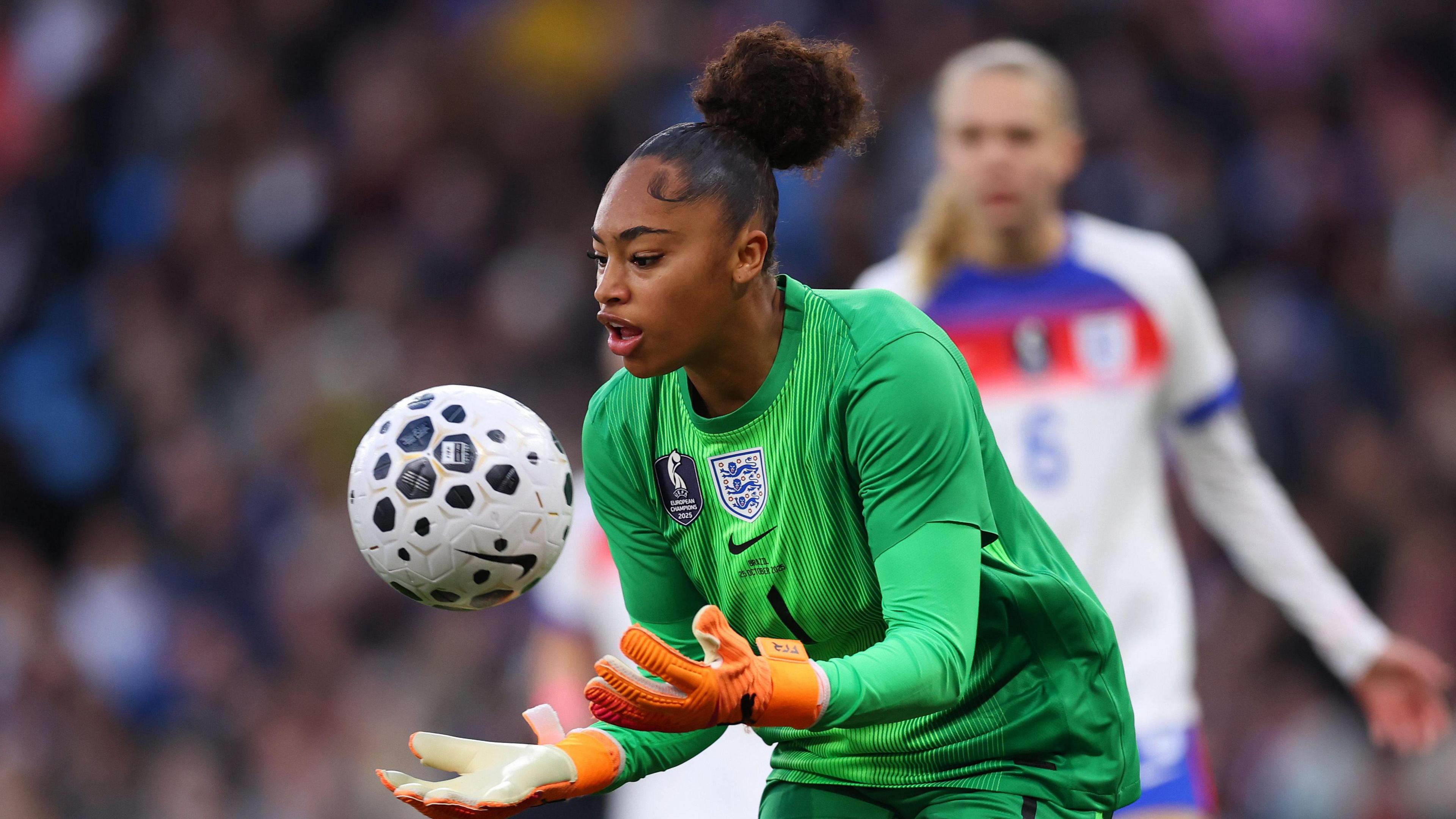 Khiara Keating catching the football on her England debut