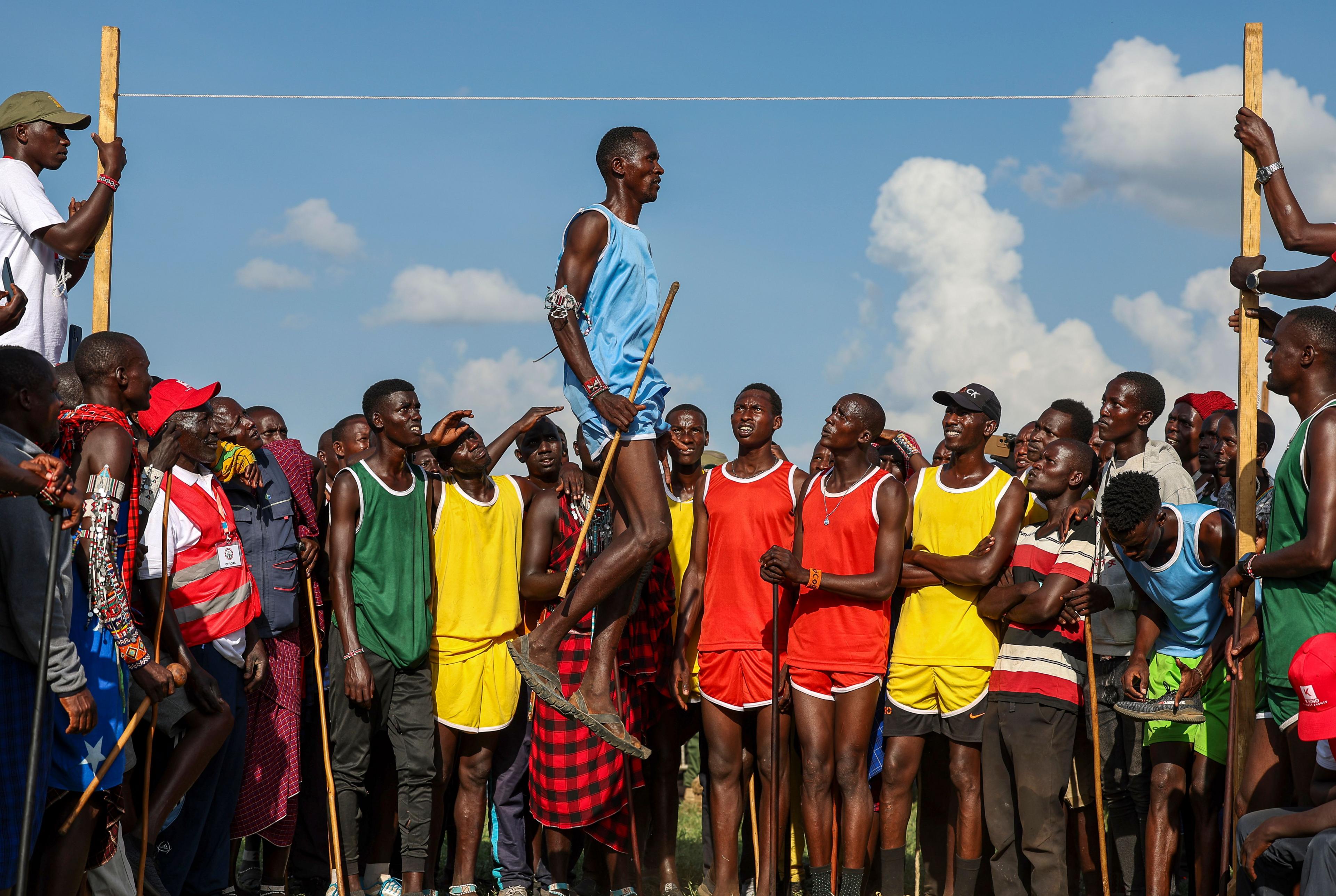 A Maasai warrior captured mid-air as he competes in the high jump event in Kajiado, Kenya - Saturday 14 December 2024