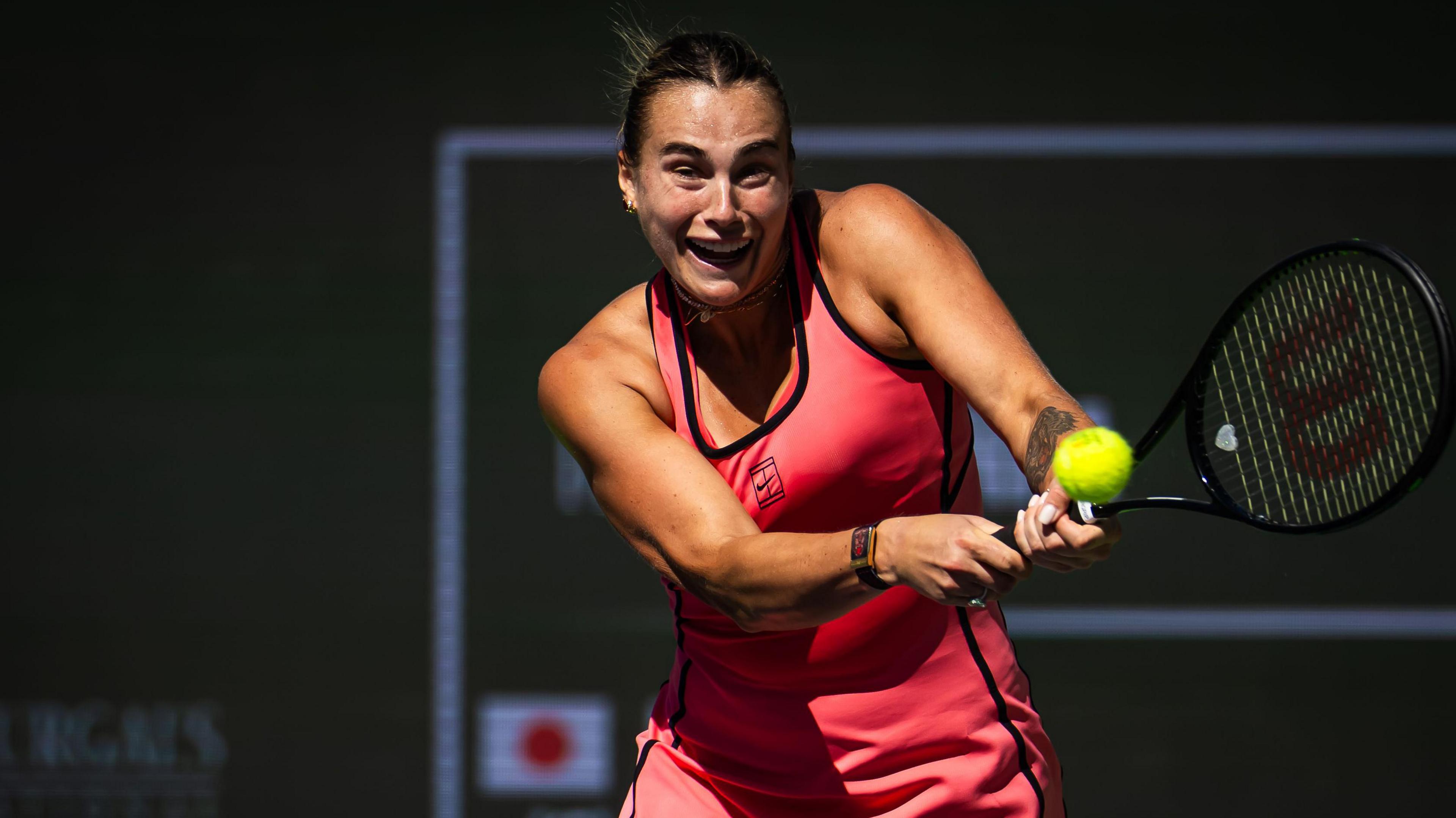 Aryna Sabalenka with a back hand against Naomi Osaka