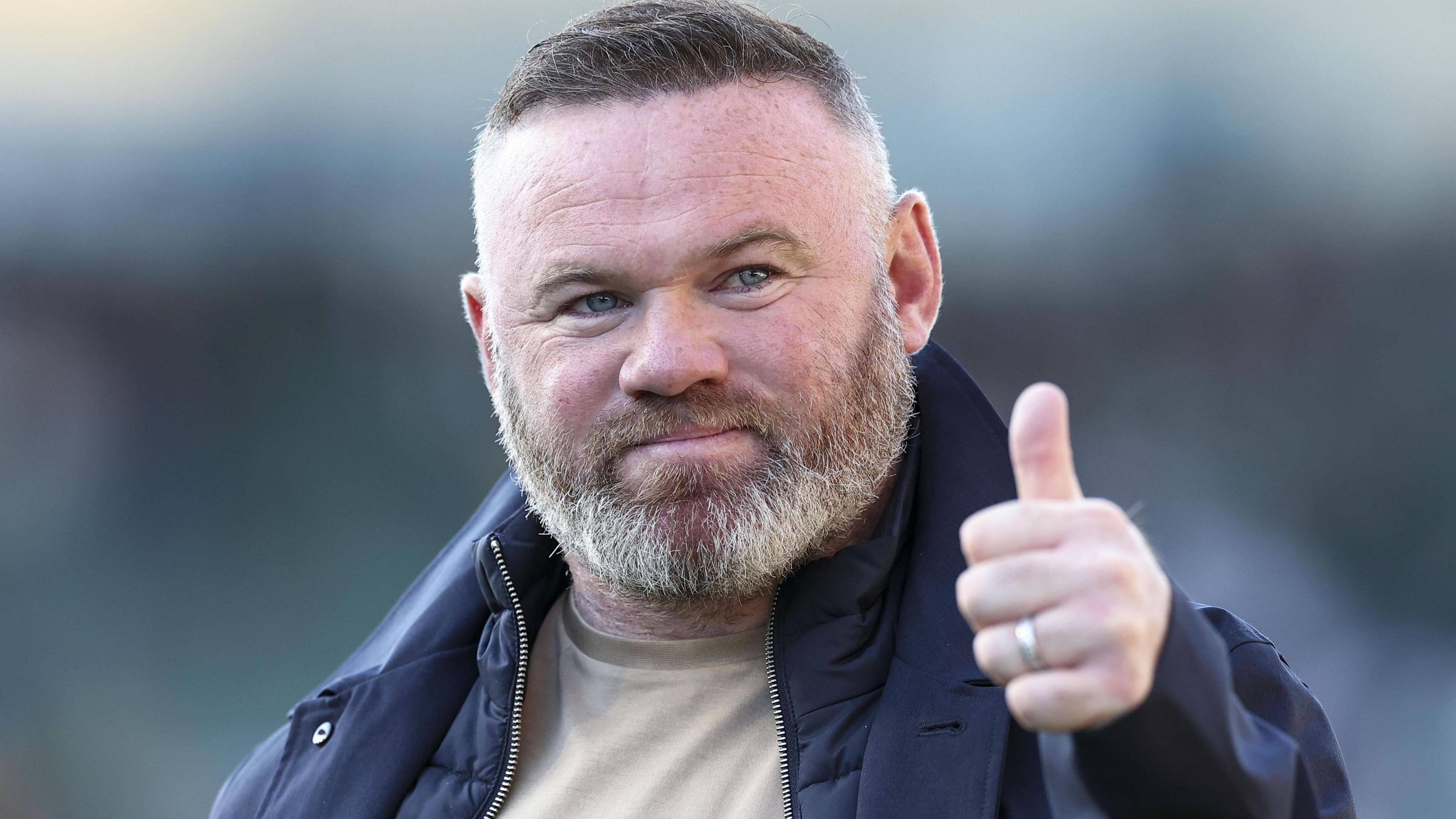 Wayne Rooney gives a thumbs-up to Argyle fans