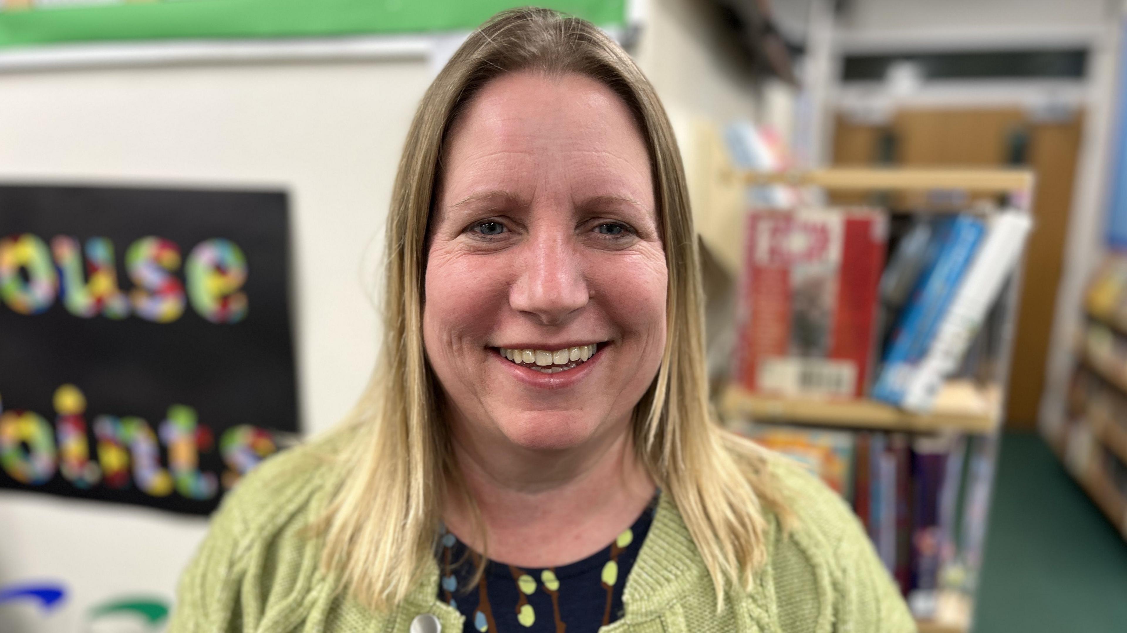 Kate Mackinnon, Headteacher at Greenmeadow Primary School, Swindon smiling with shoulder length blond hair