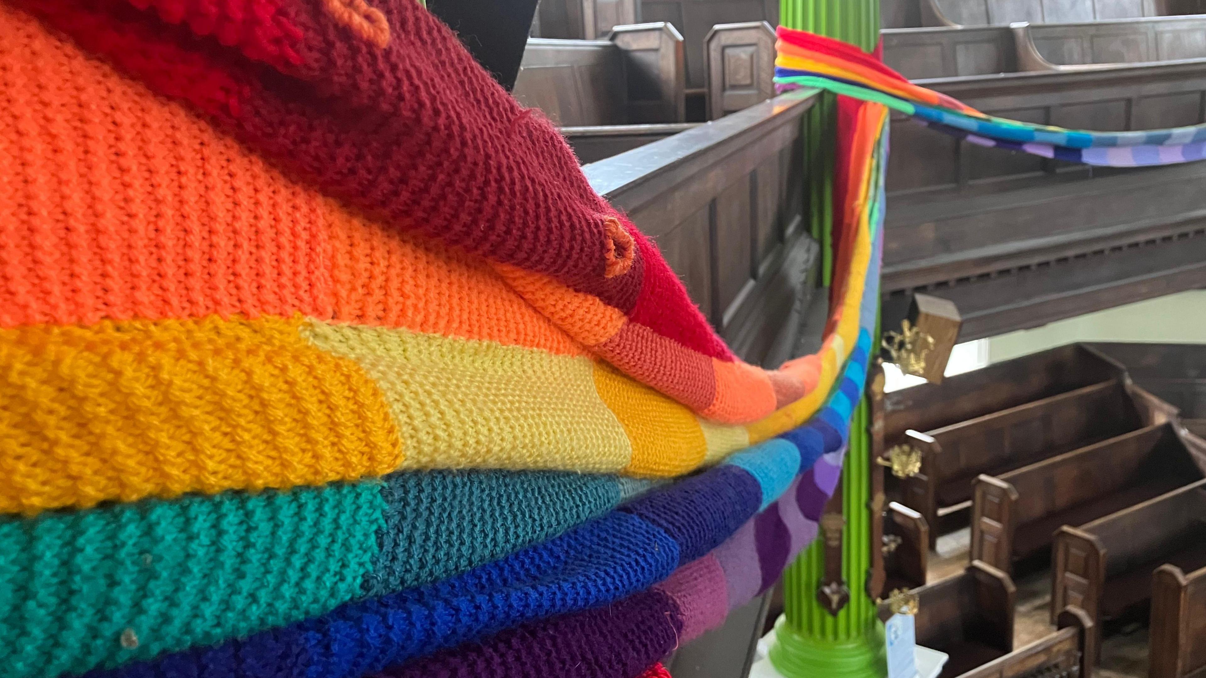 The knitted flag, wrapped around the the Octogen Chapel in Norwich.