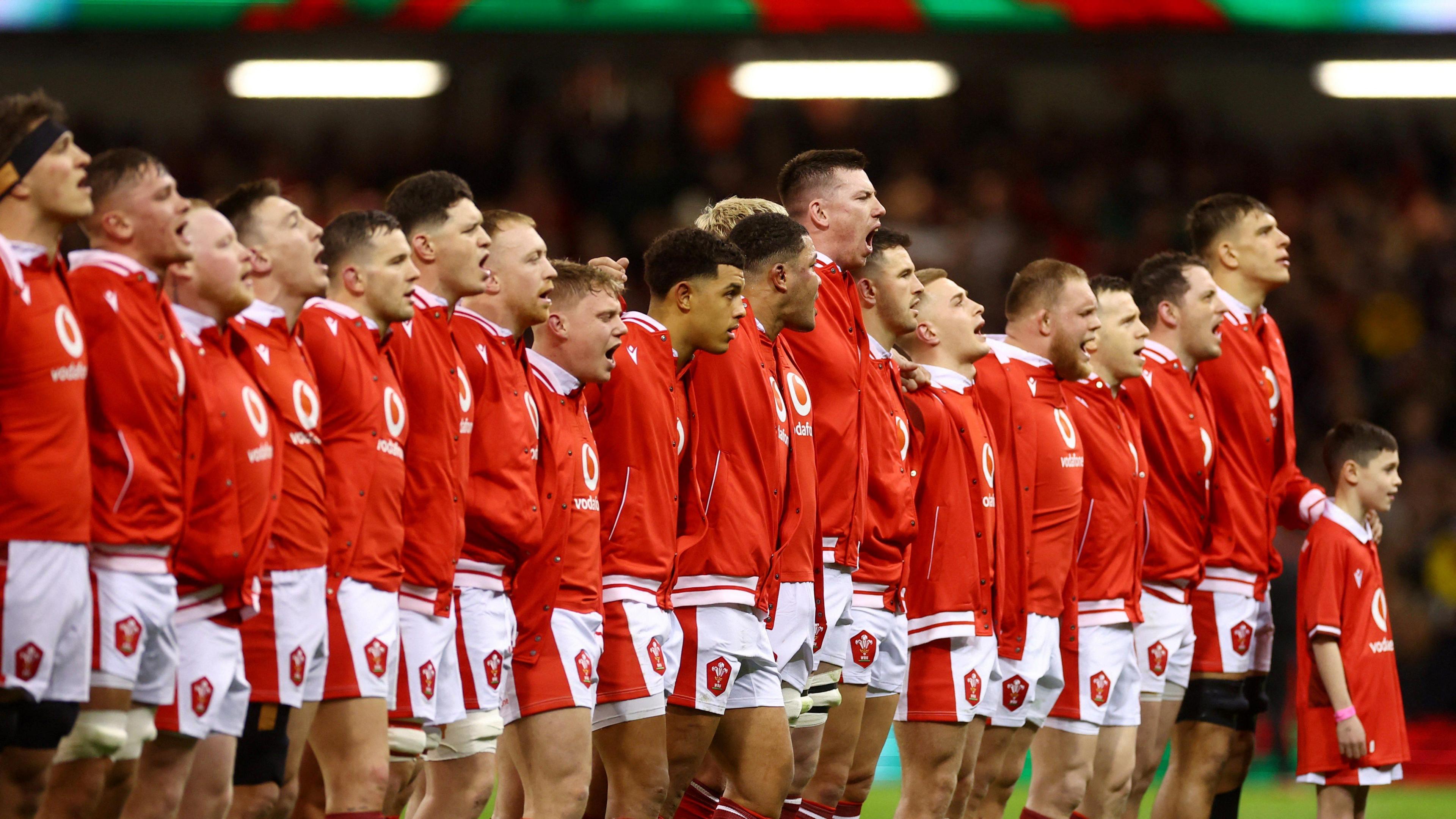 The Wales team sing the national anthem