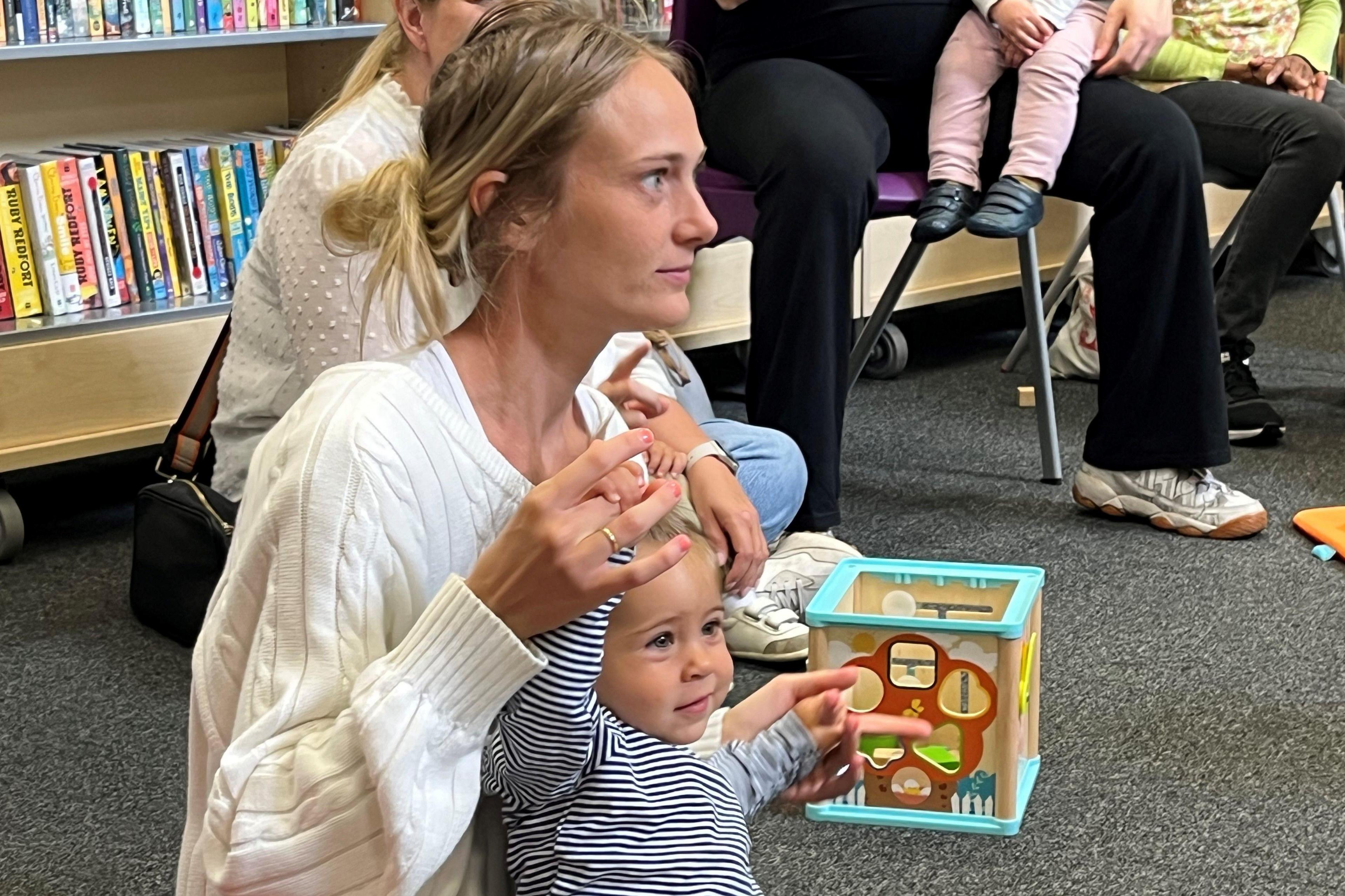 Toddler Ava enjoying Baby Rhyme Time at Brompton Library with her mum Sandrina Spiteri-Gonzi
