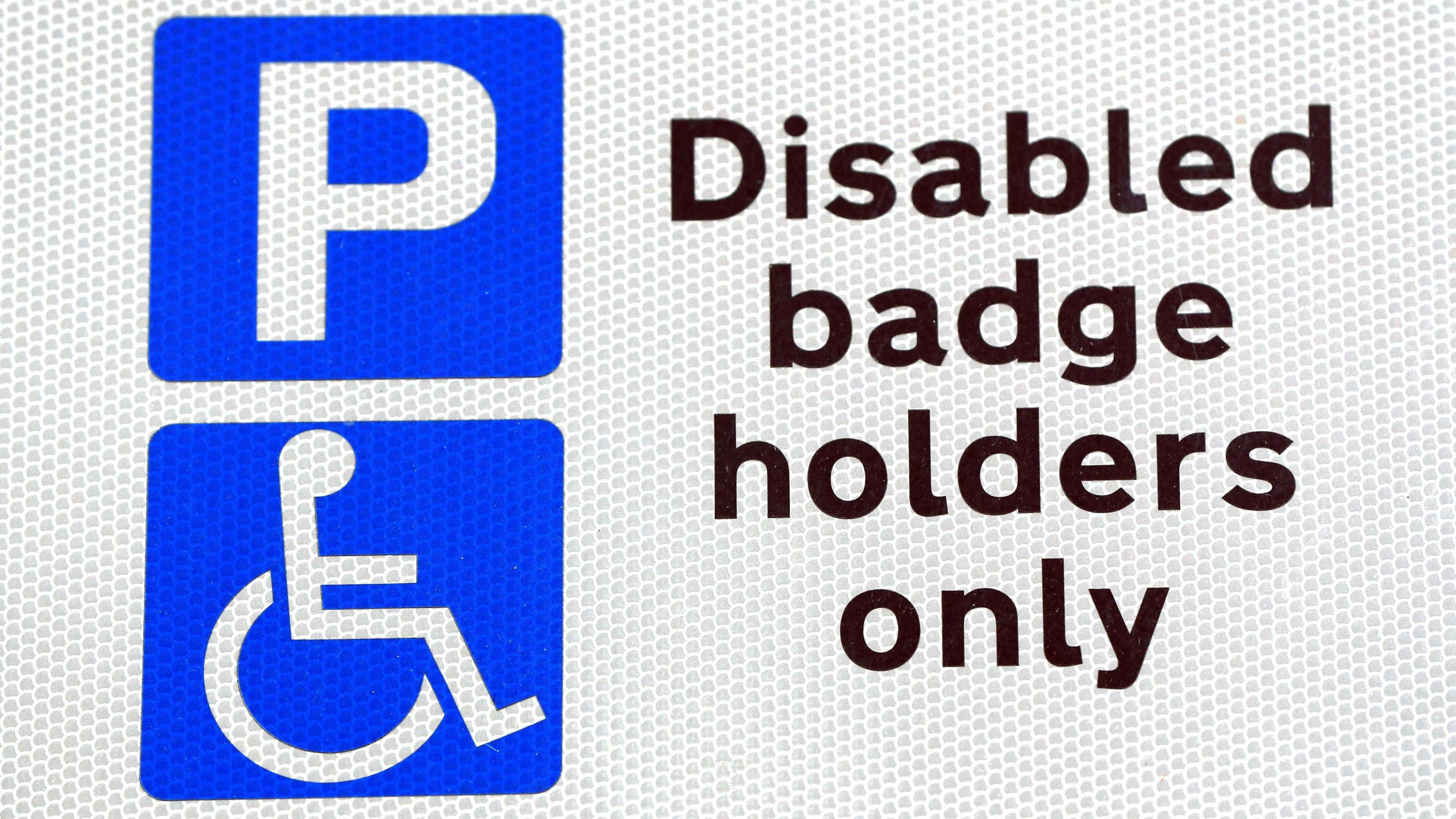 A traffic sign stating the area can only be accessed by disabled badge holders