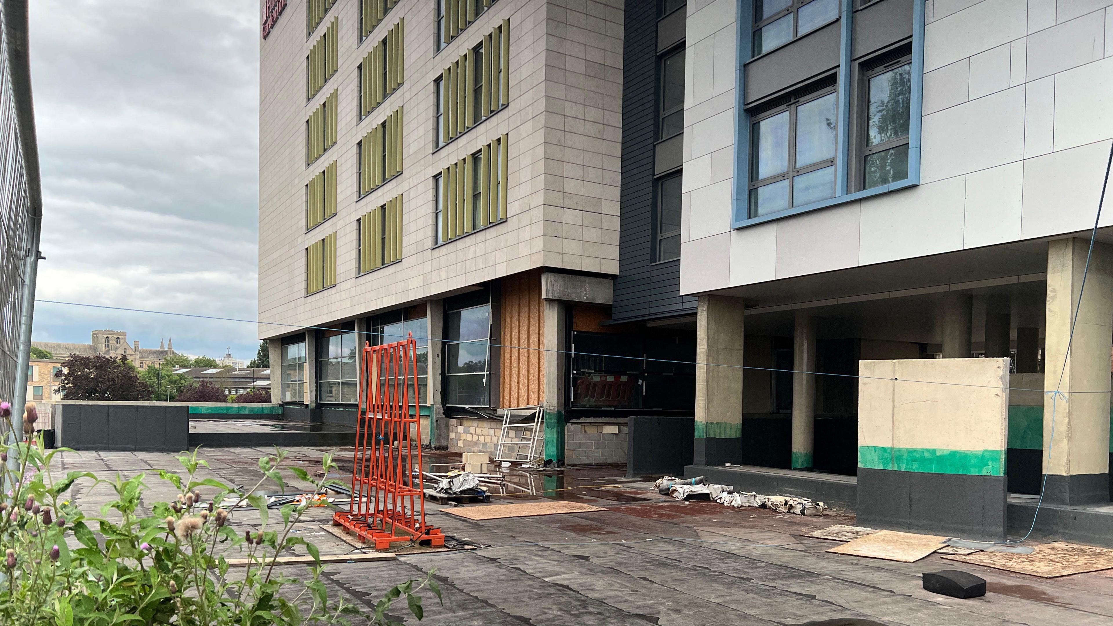 Patio outside the hotel with construction items outside it
