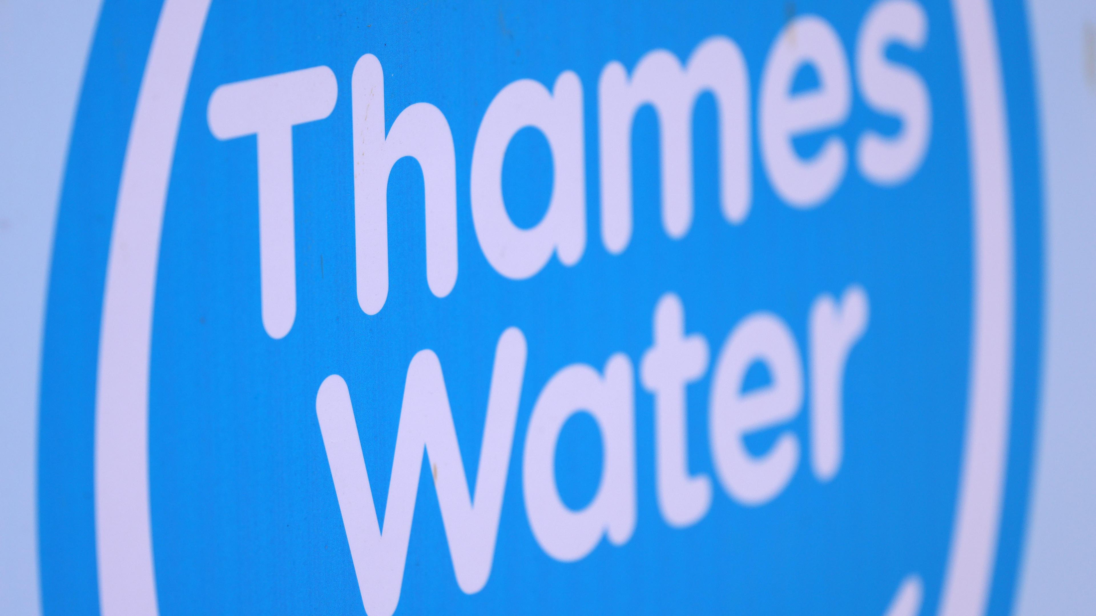 Thames Water logo. The letters are white and inside a blue circle. 