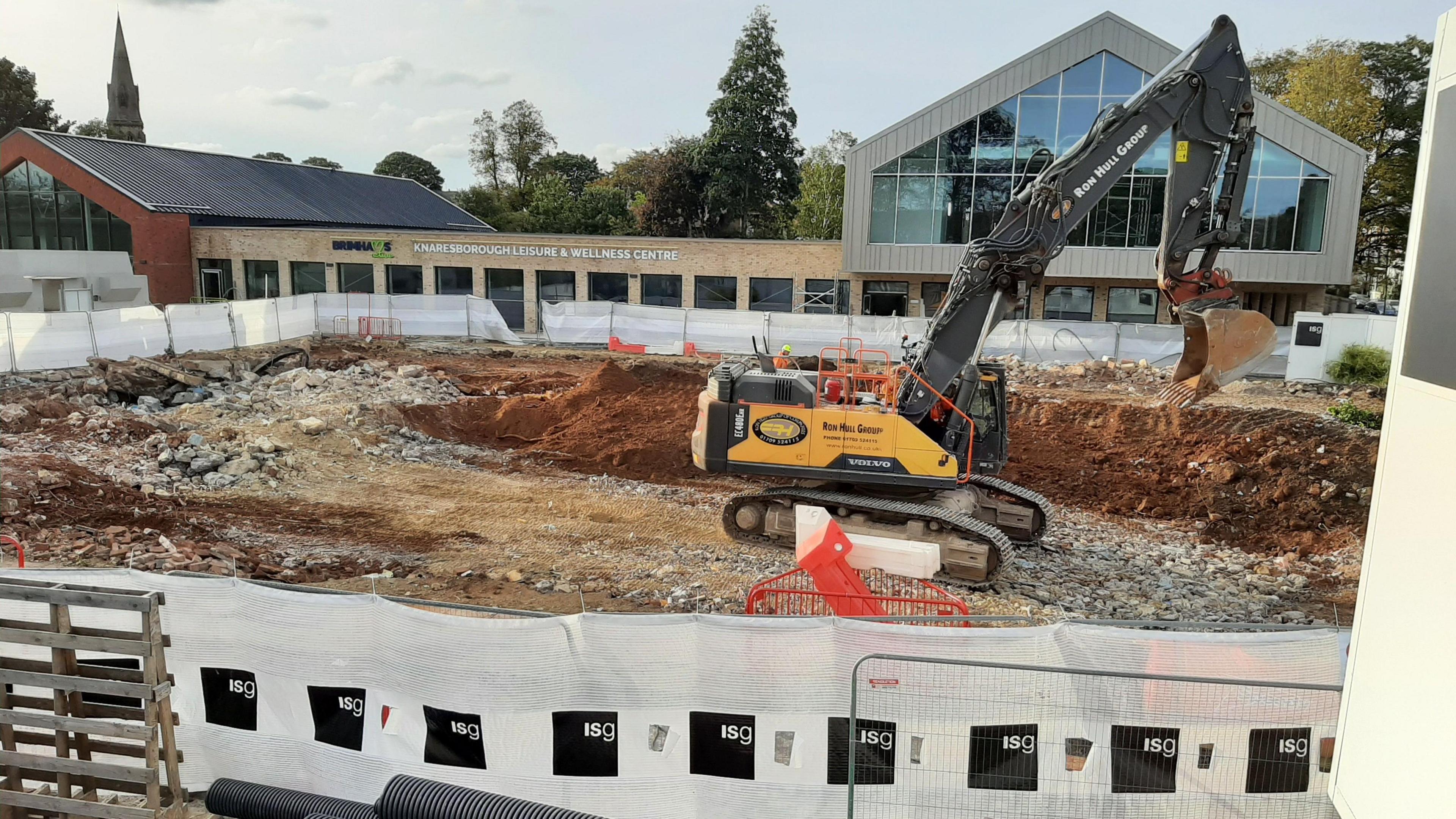 An excavator in the construction site of the leisure centre