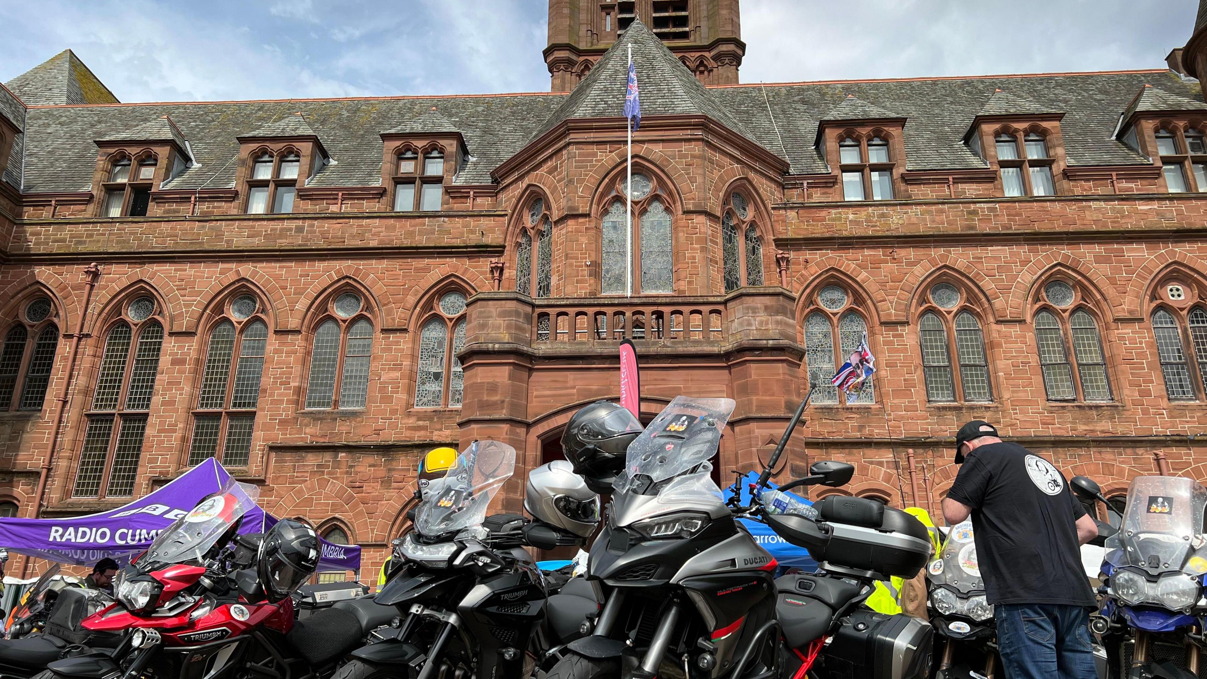 Hundreds of motorcyclists are lined up outside Barrow 