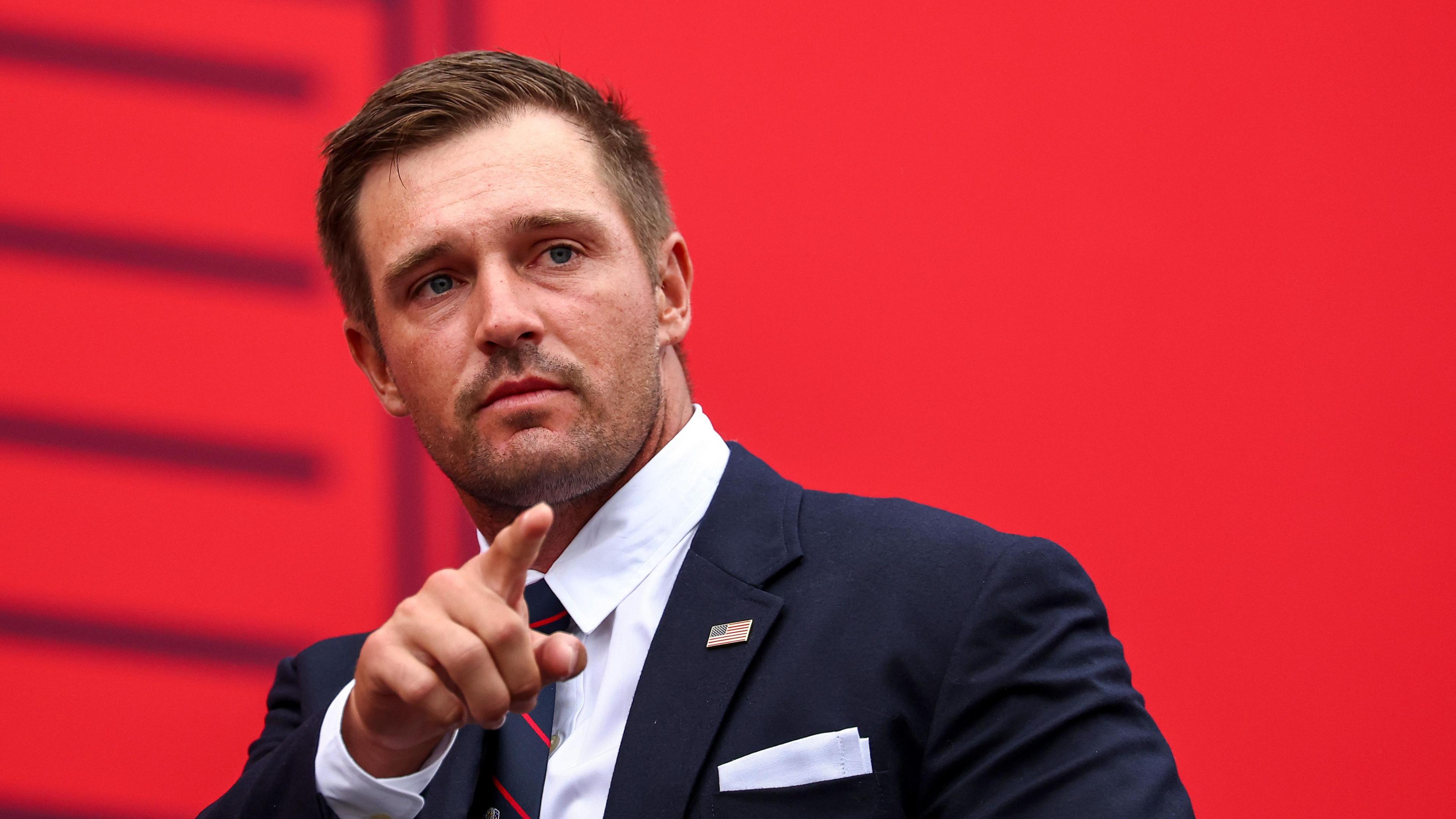 Bryson DeChambeau acknowledges the Ryder Cup crowd during Wednesday's opening ceremony