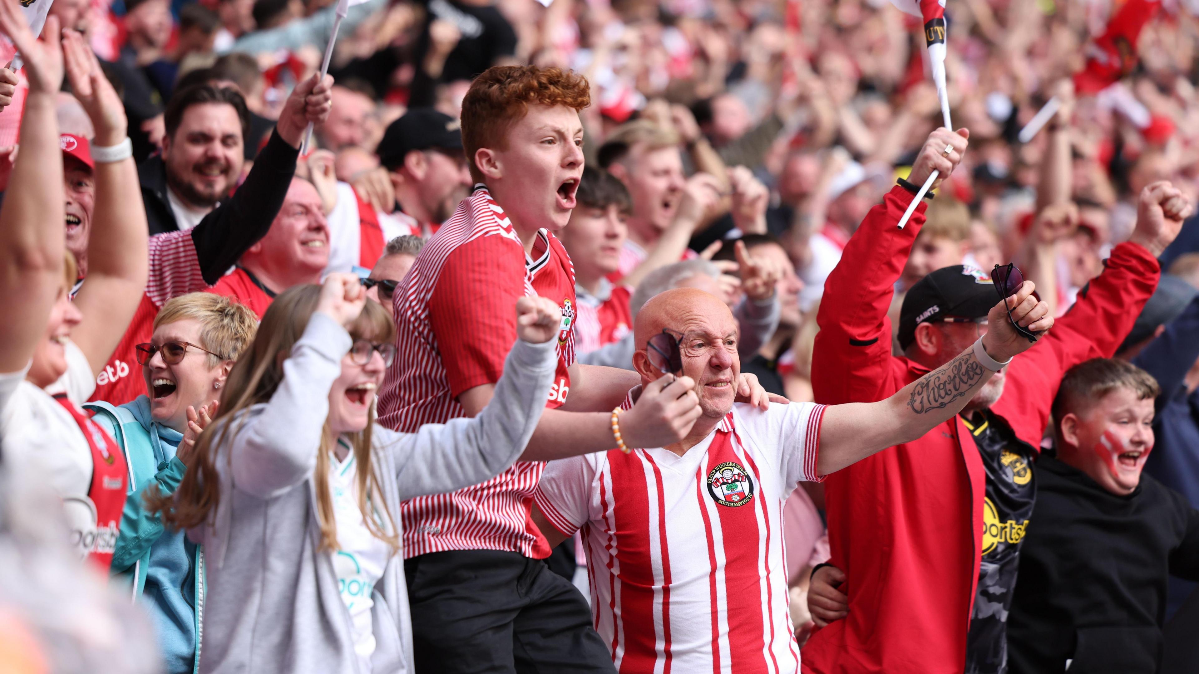 Southampton fans celebrate in the stand at Wembley