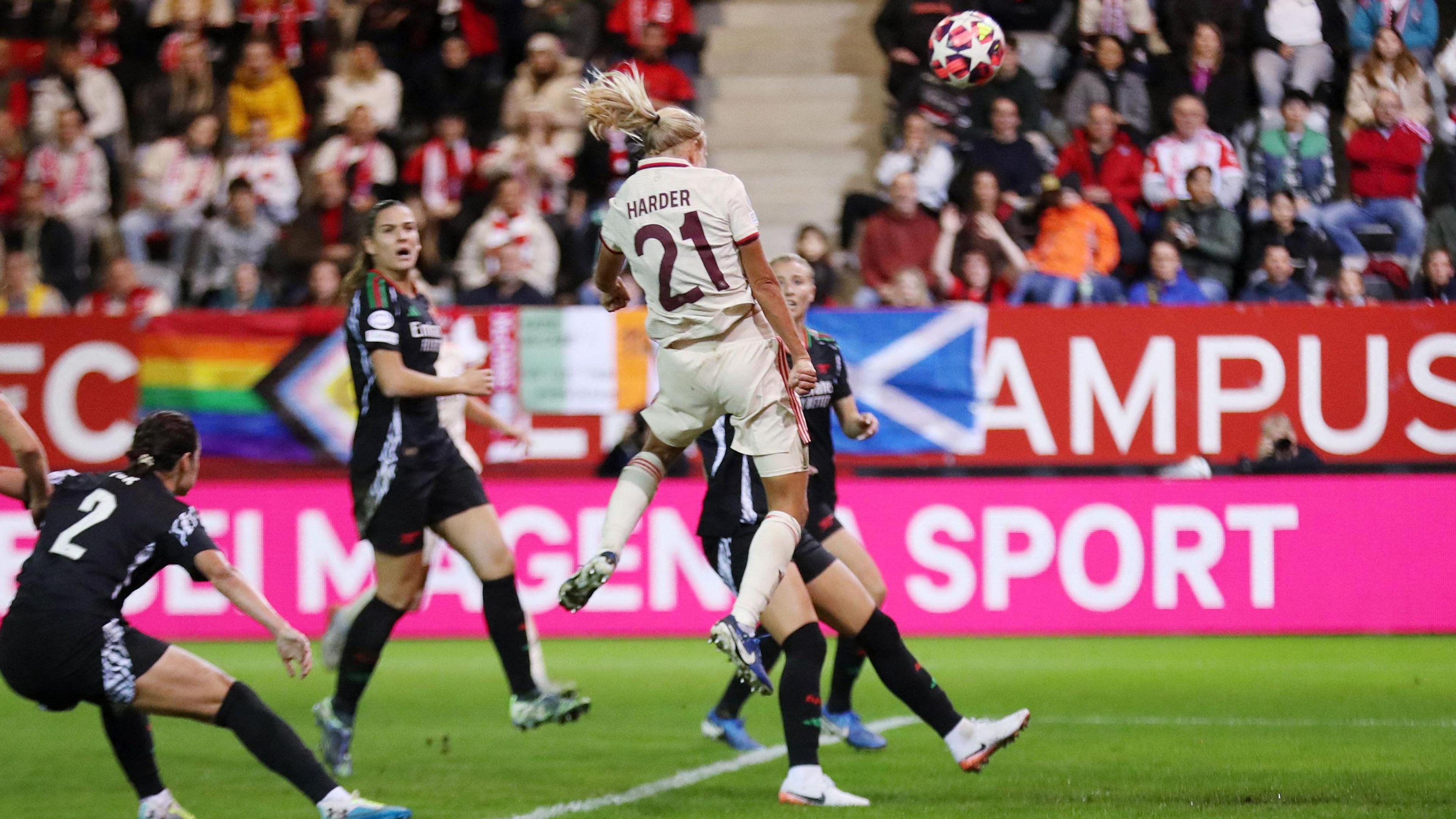 Pernille Harder jumps to head the ball