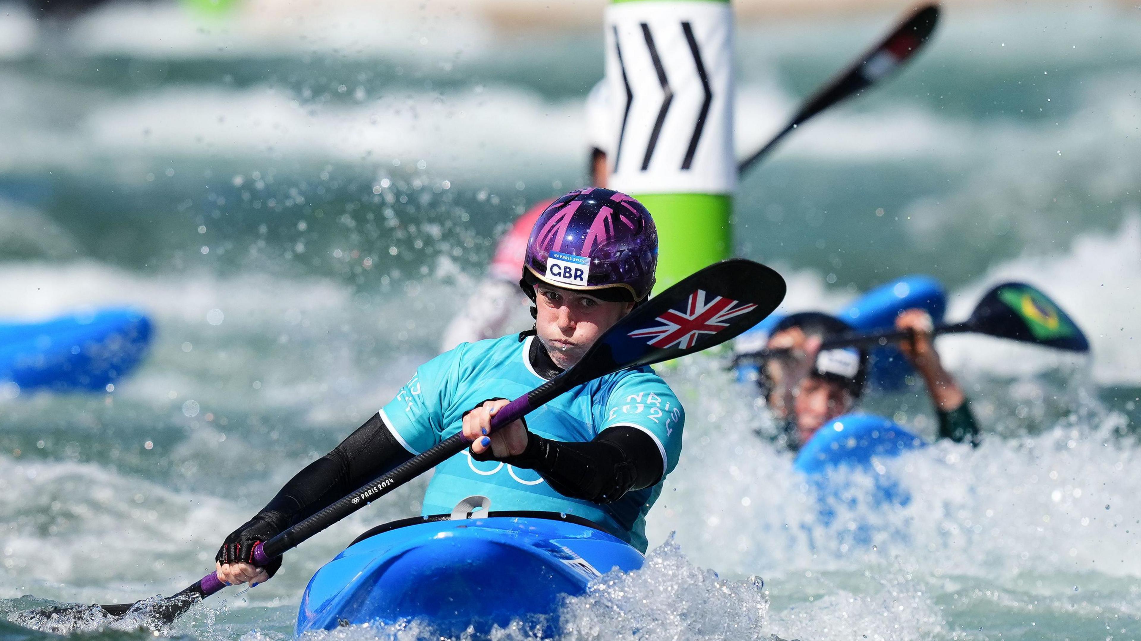 Kimberley Woods competes in the women's kayak cross semi-final 2 